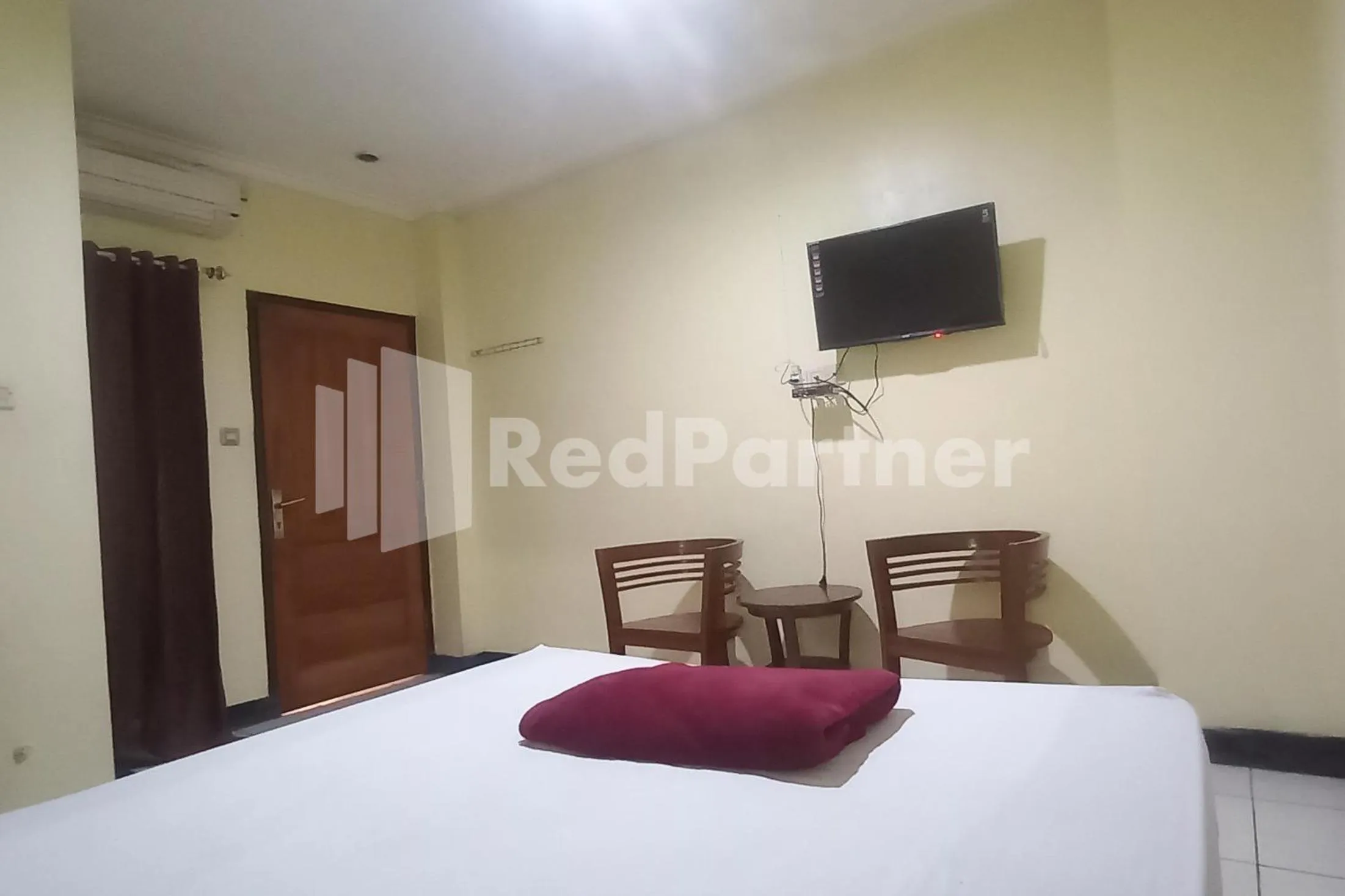 Bedroom, Bed in Hotel Palem 2 Syariah Malang Redpartner