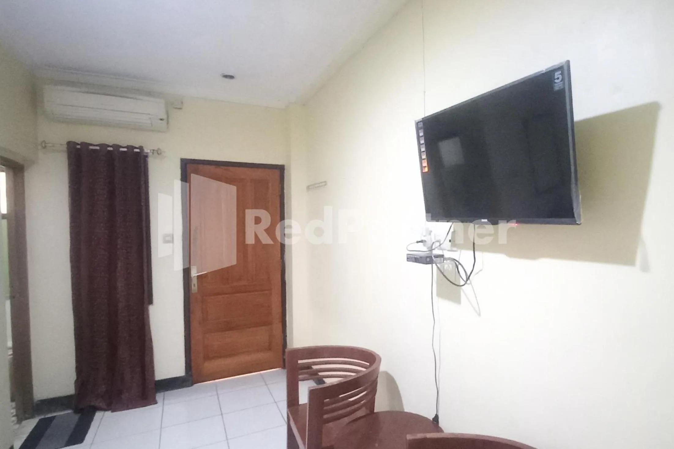 Bedroom in Hotel Palem 2 Syariah Malang Redpartner