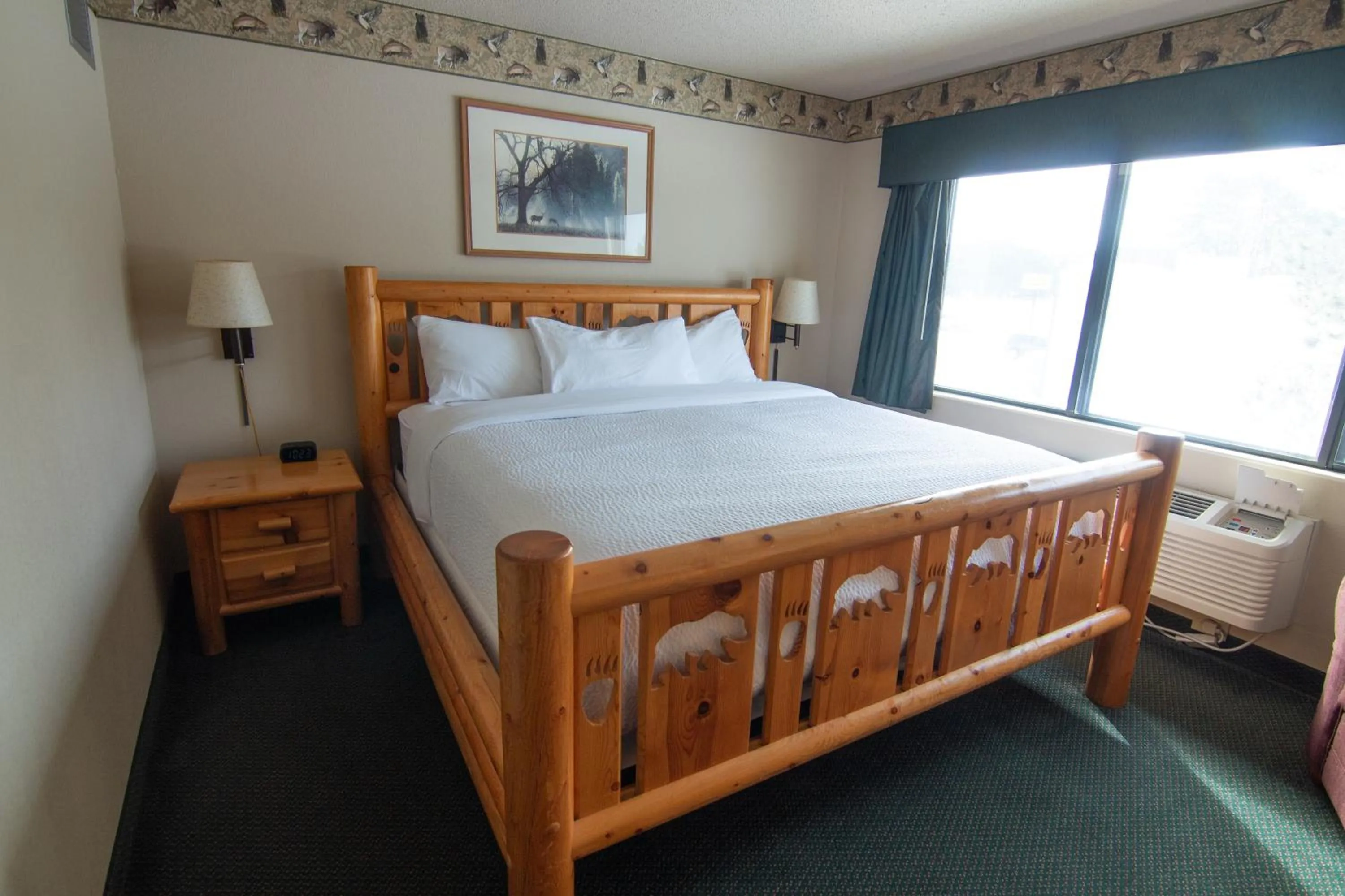 Bed in Shell Lake Lodge, a Travelodge by Wyndham
