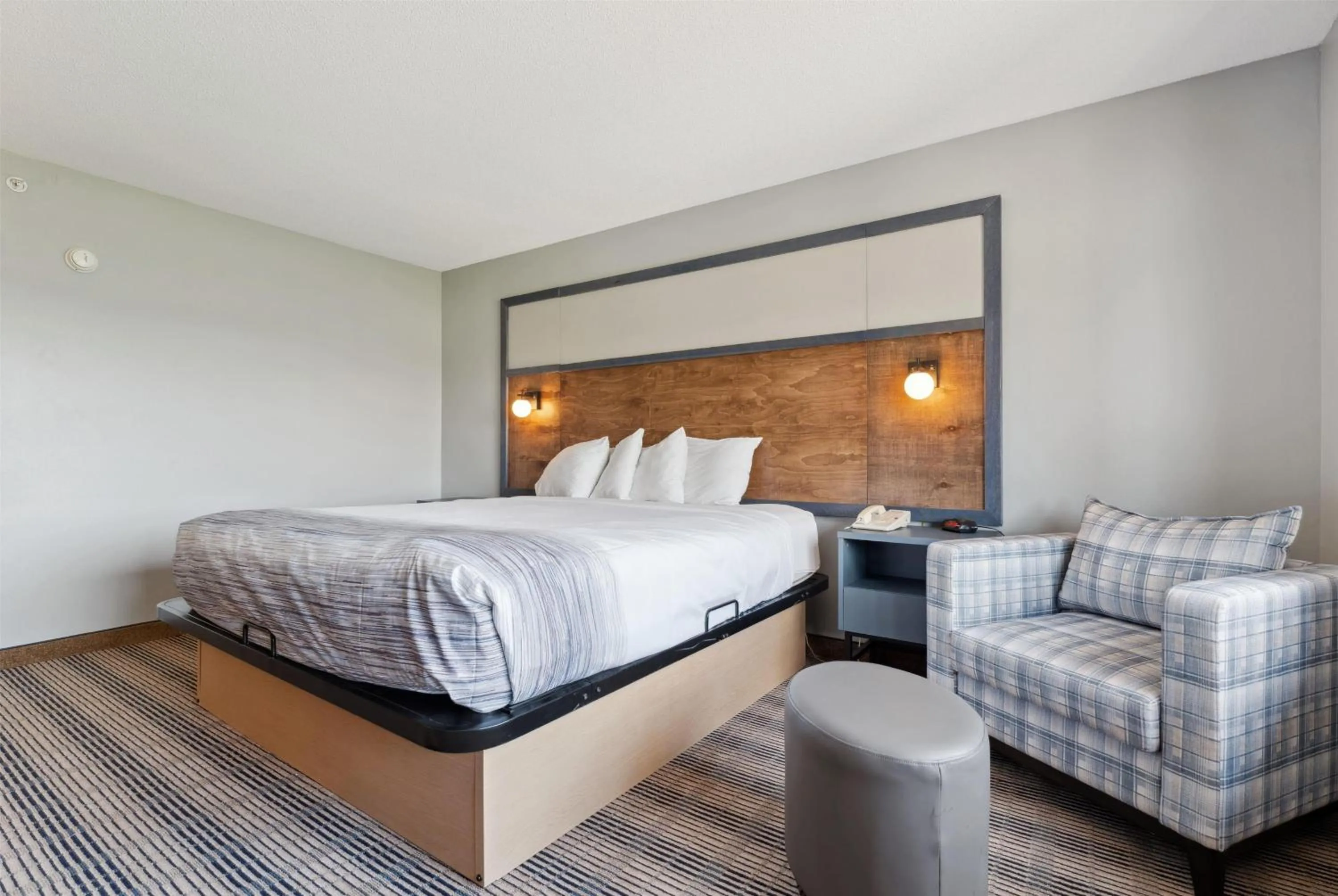 Bed in AmericInn by Wyndham Wisconsin Dells