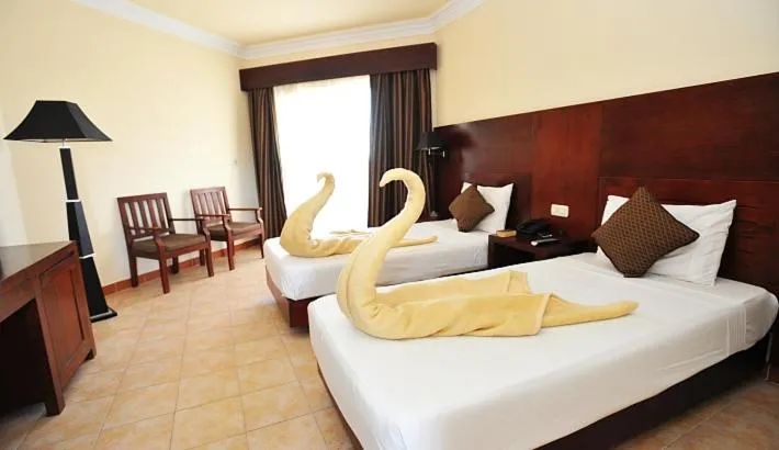 Bed in Royal Brayka Beach Resort