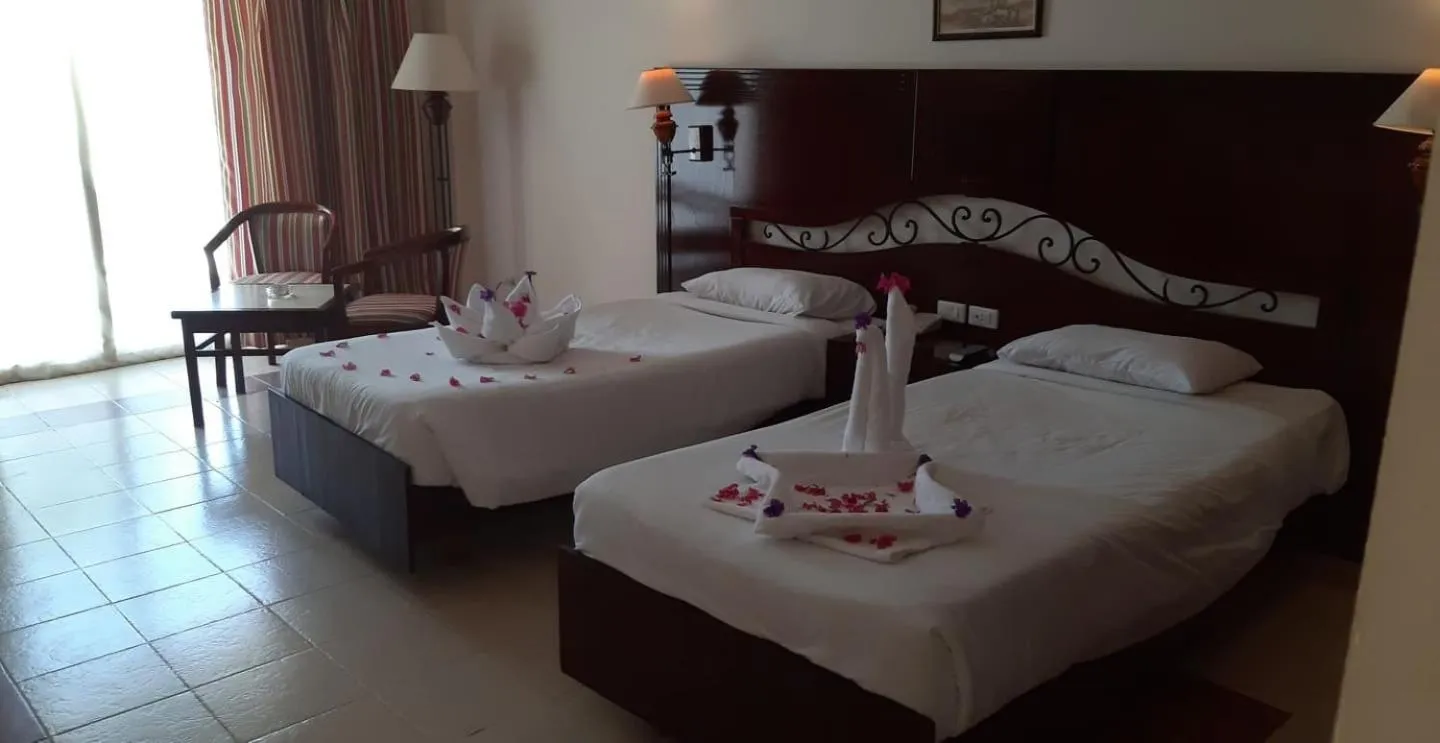 Bed in Royal Brayka Beach Resort