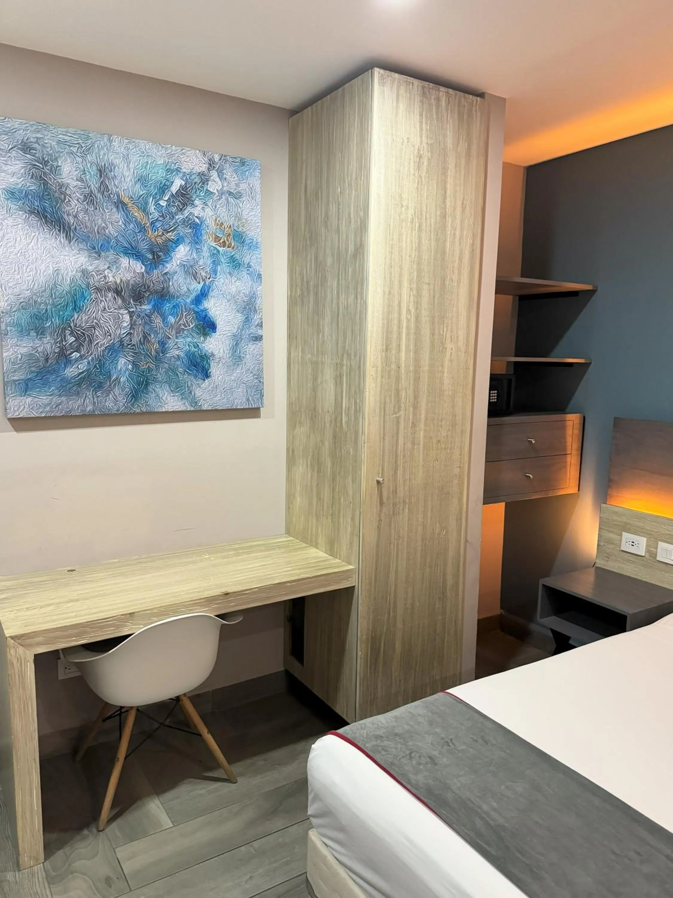 Seating area, Bed in Illusion Xpress I Attraction Hotel Deluxe