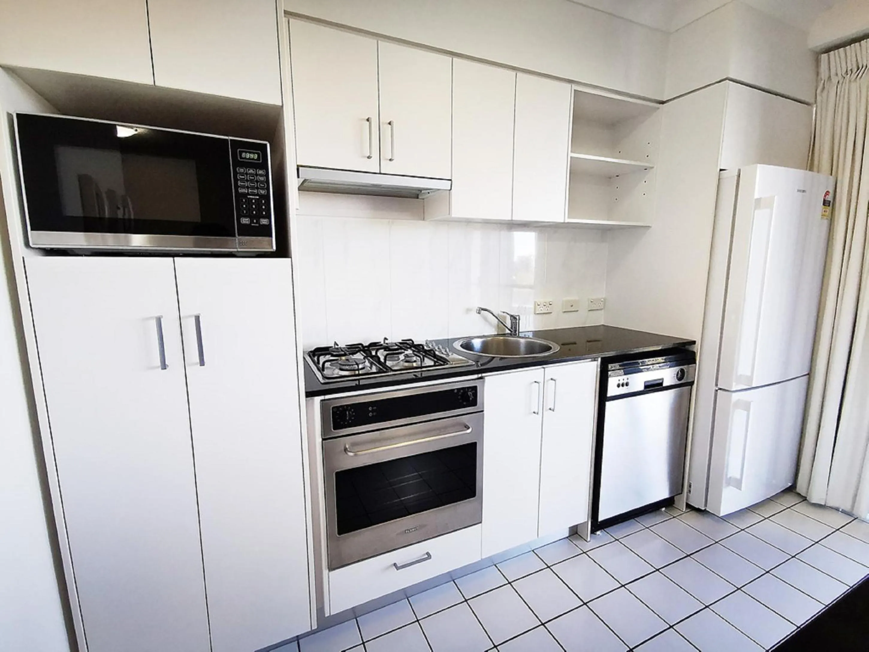 Kitchen or kitchenette in Inn on the Park Apartments