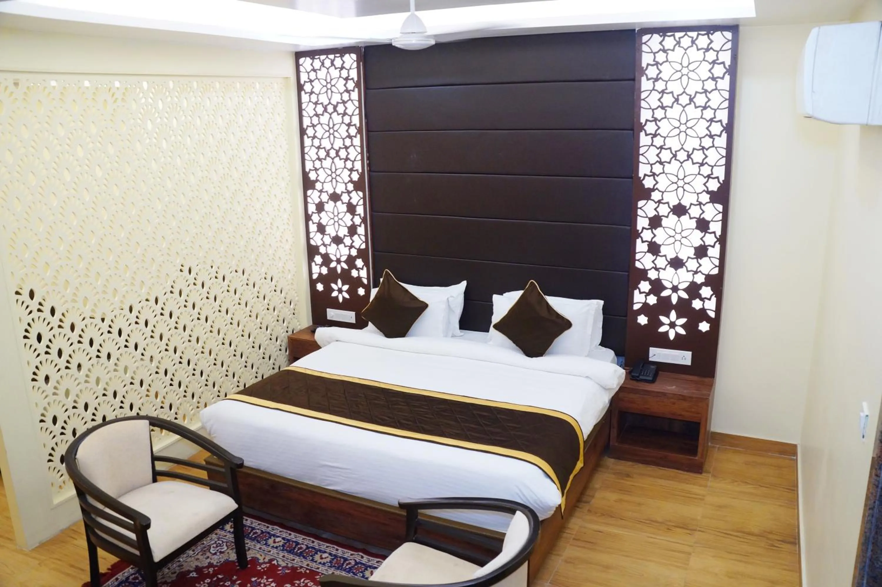 Bed in HOTEL SHIVOY GRAND