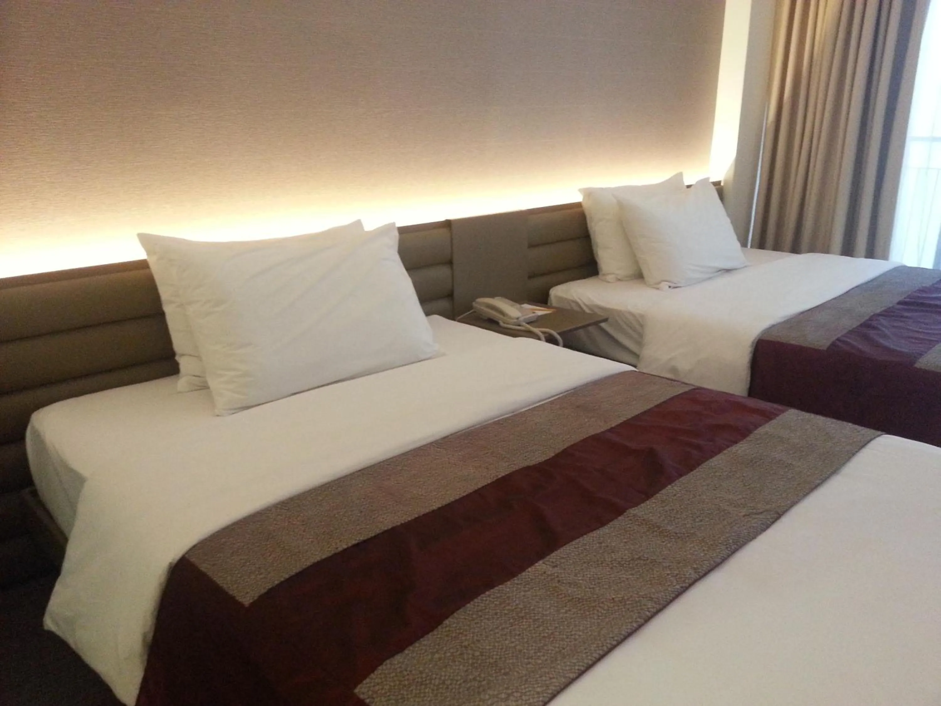 Bed in The E-Hotel Makati