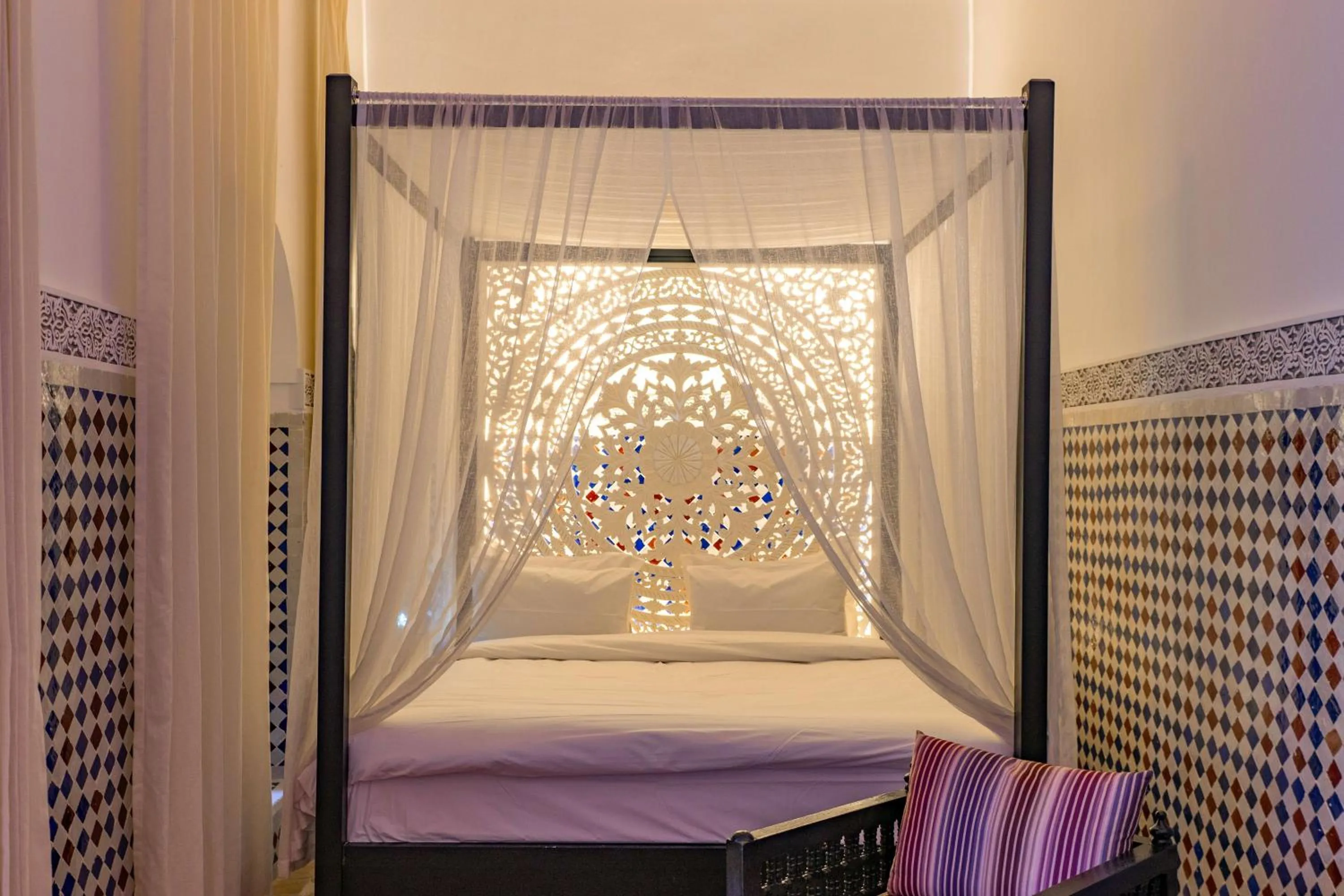 Bed in Riad Dar Dialkoum