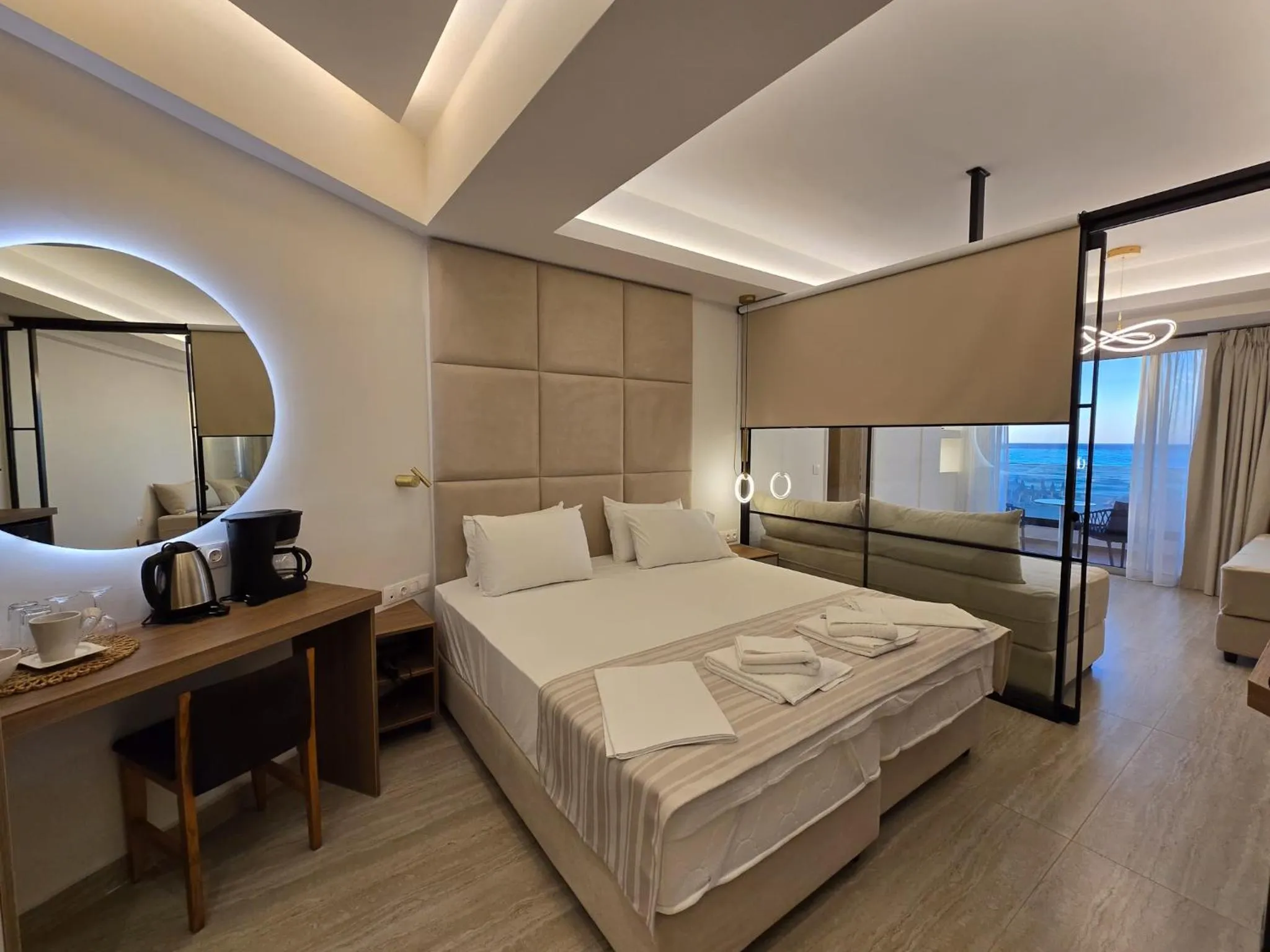 Bed in Theo Beach Hotel Apartments