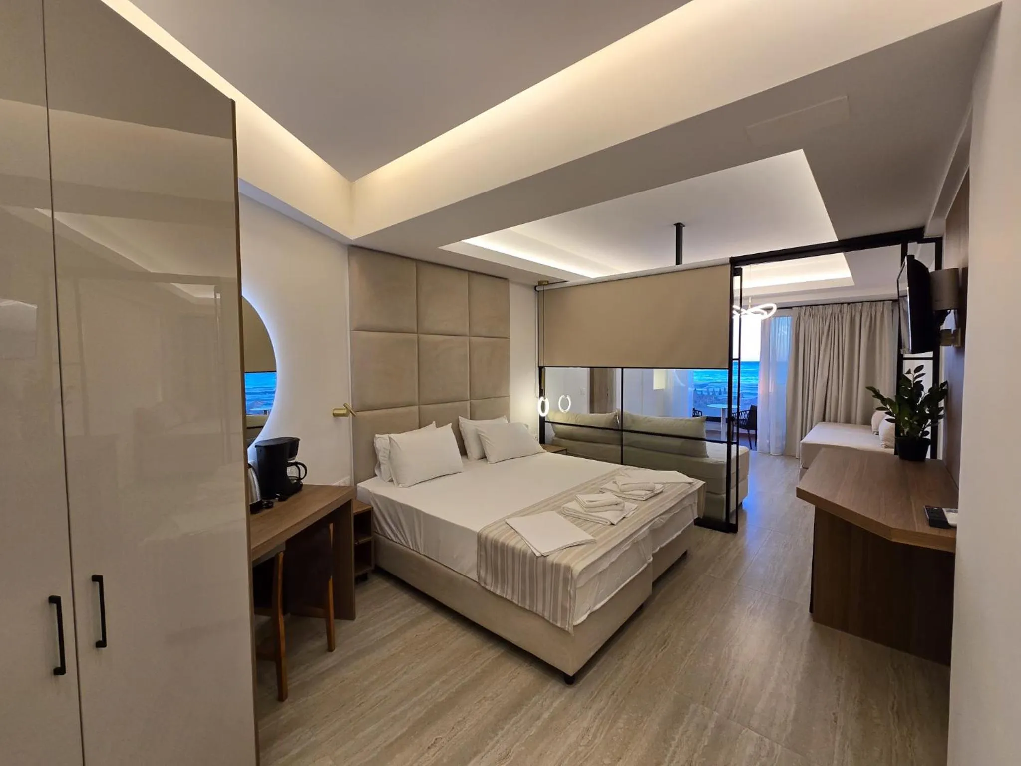 Bed in Theo Beach Hotel Apartments