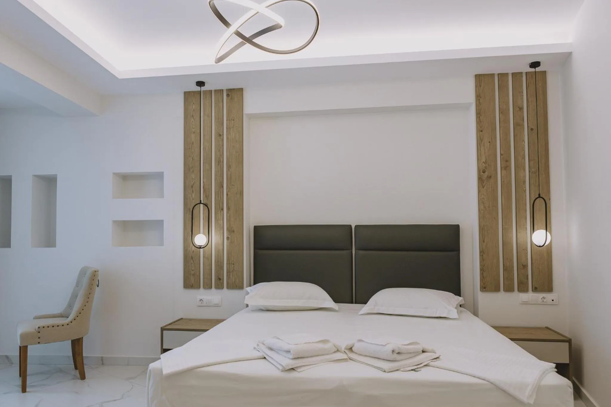 Bed in Theo Beach Hotel Apartments