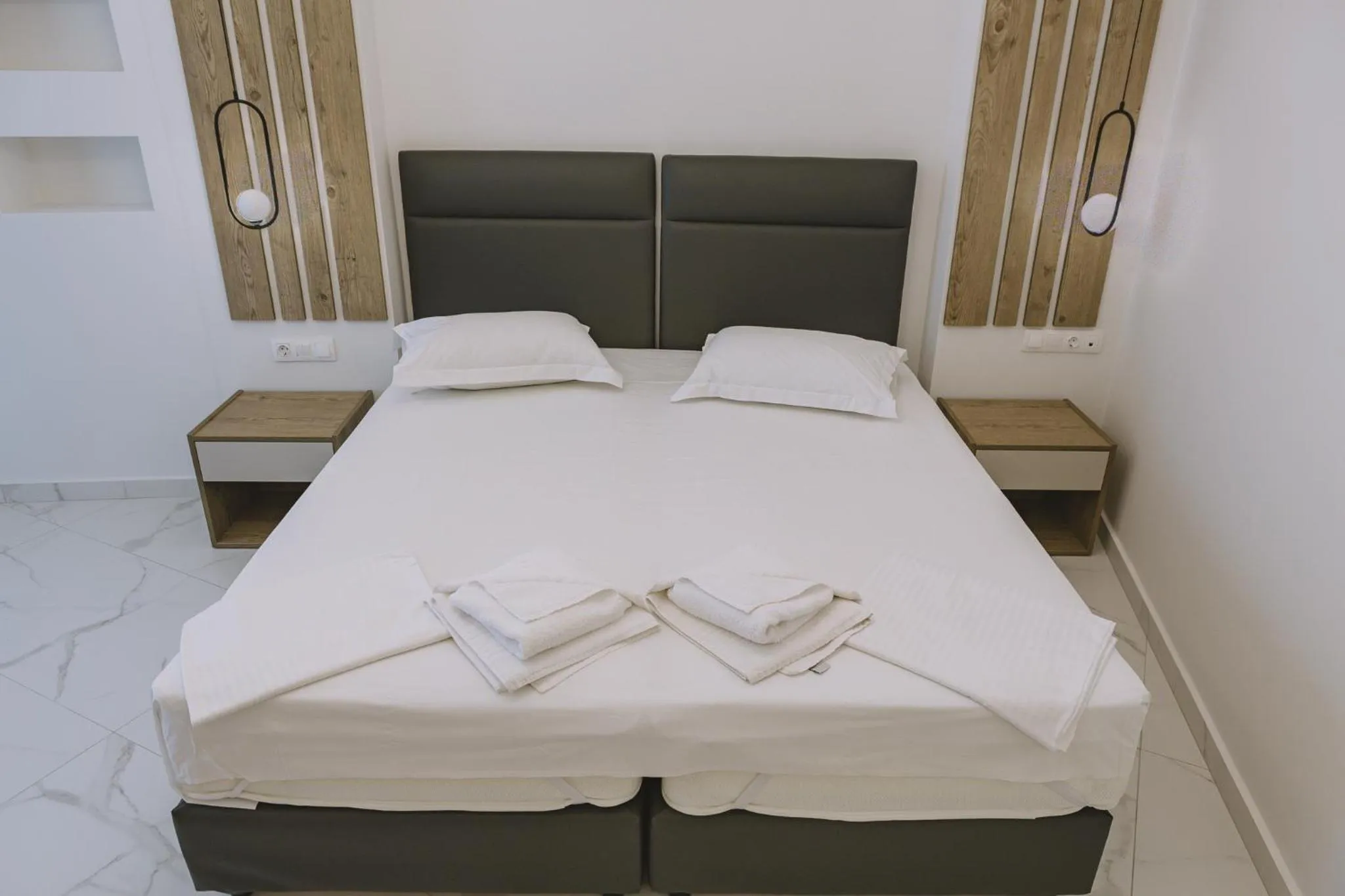 Bed in Theo Beach Hotel Apartments