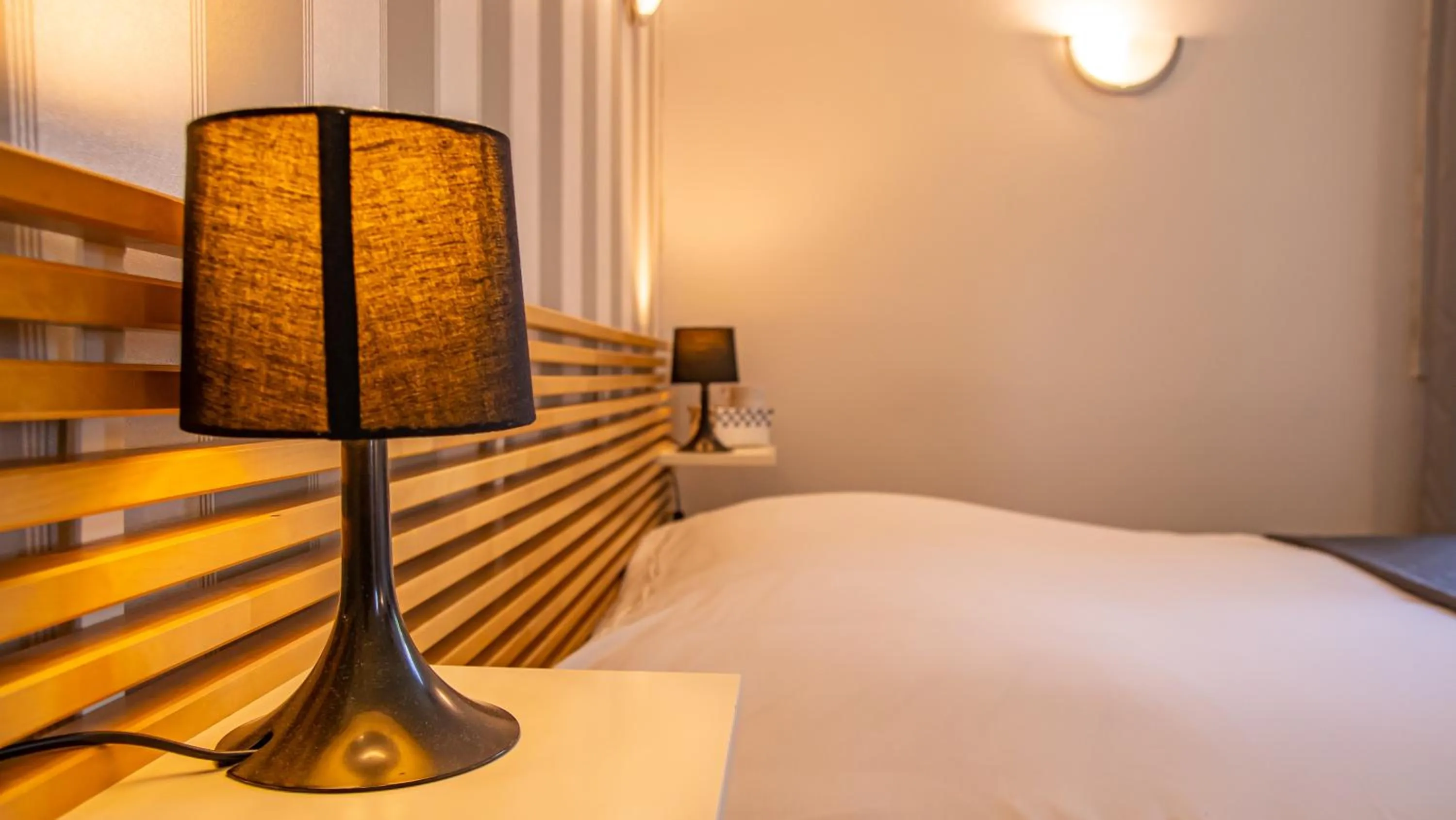 Bed in Logis Hotels - Au Colombier du Touron