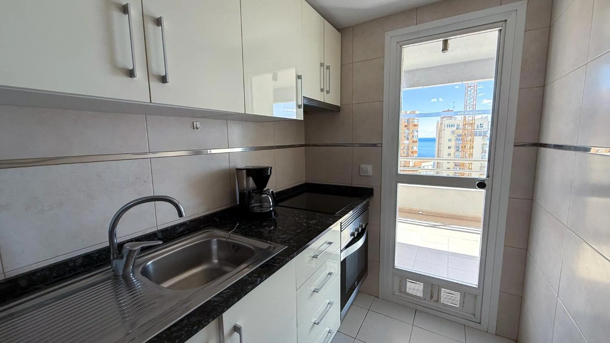 Kitchen or kitchenette in Apartamentos Esmeralda Unitursa