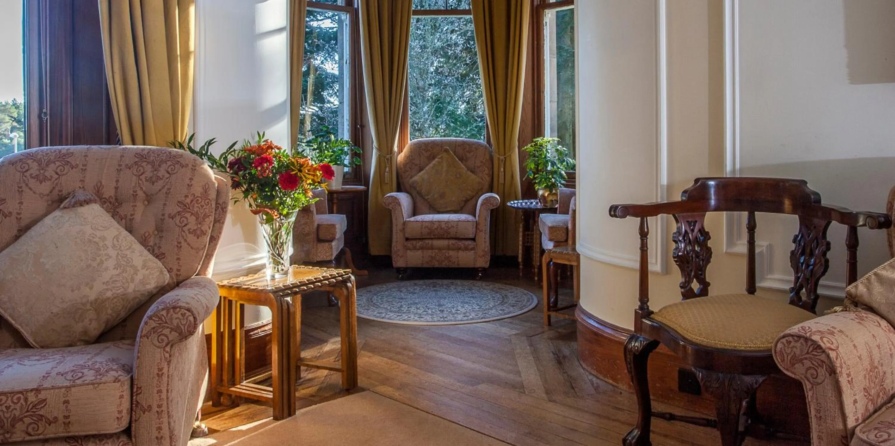 Communal lounge/ TV room in Tigh na Sgiath Country House Hotel