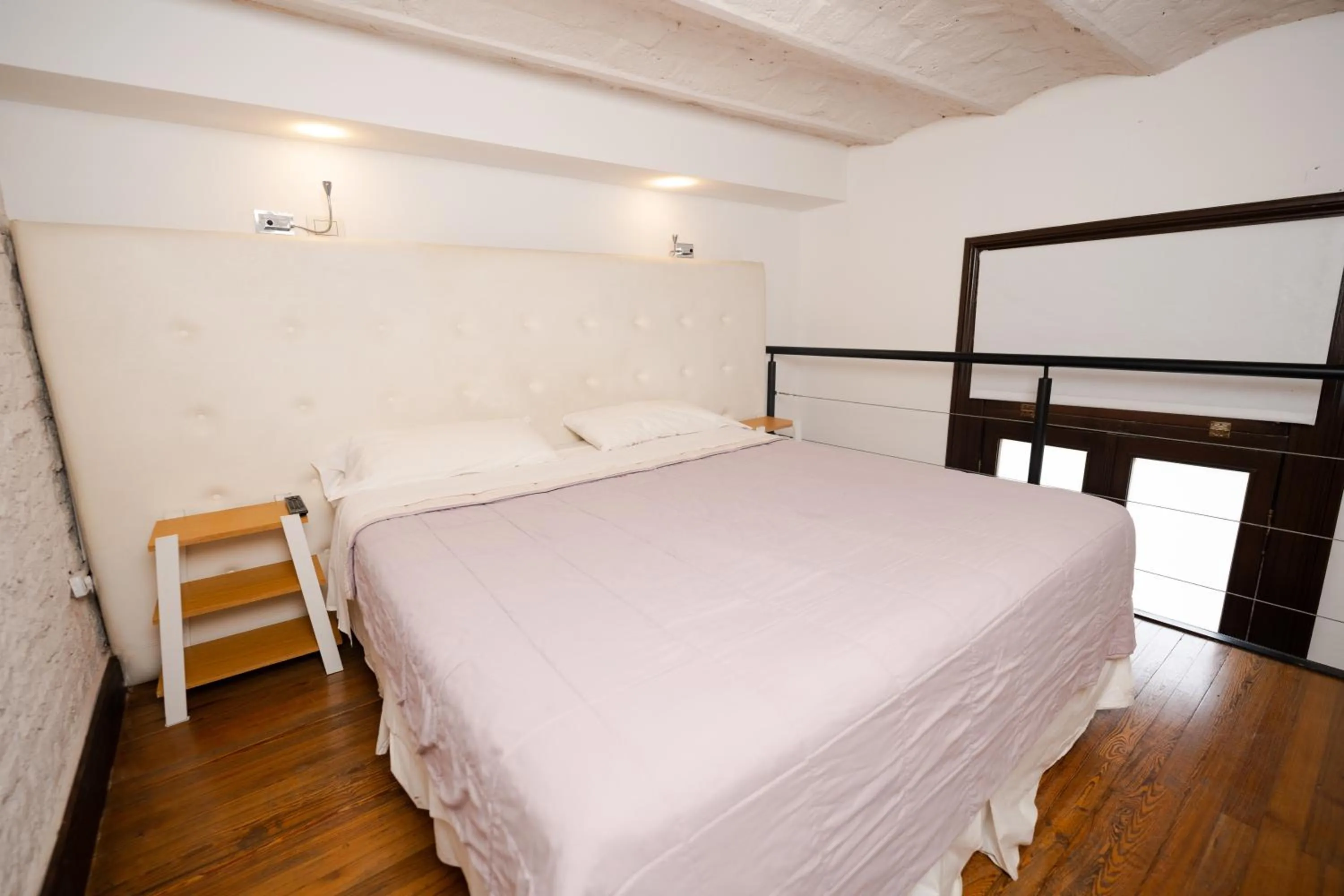 Bed in Loft Osteria by Sagardi