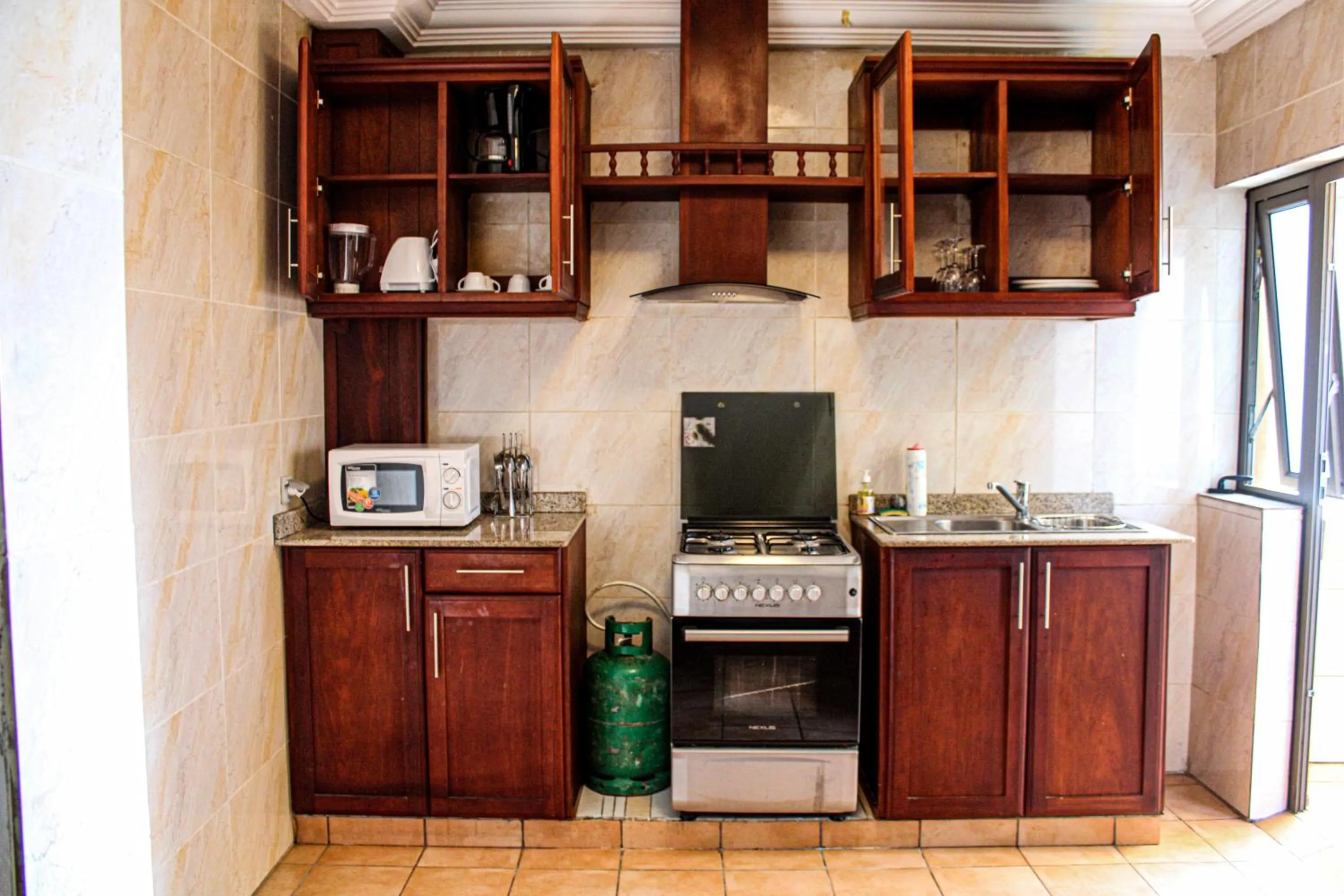 Kitchen or kitchenette in Residence Le Carat Bonapriso