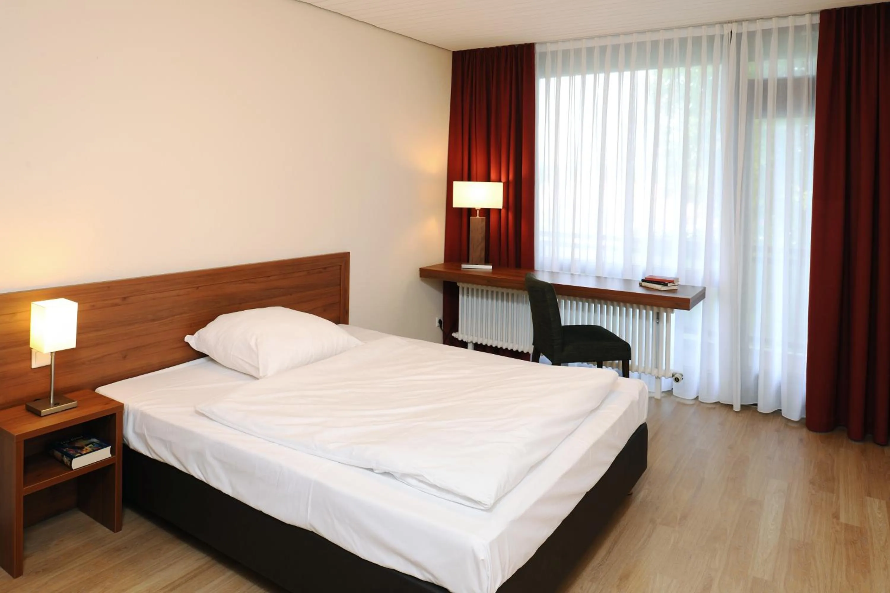 Bed in Bildungshaus St. Bernhard - Wohnen und Tagen