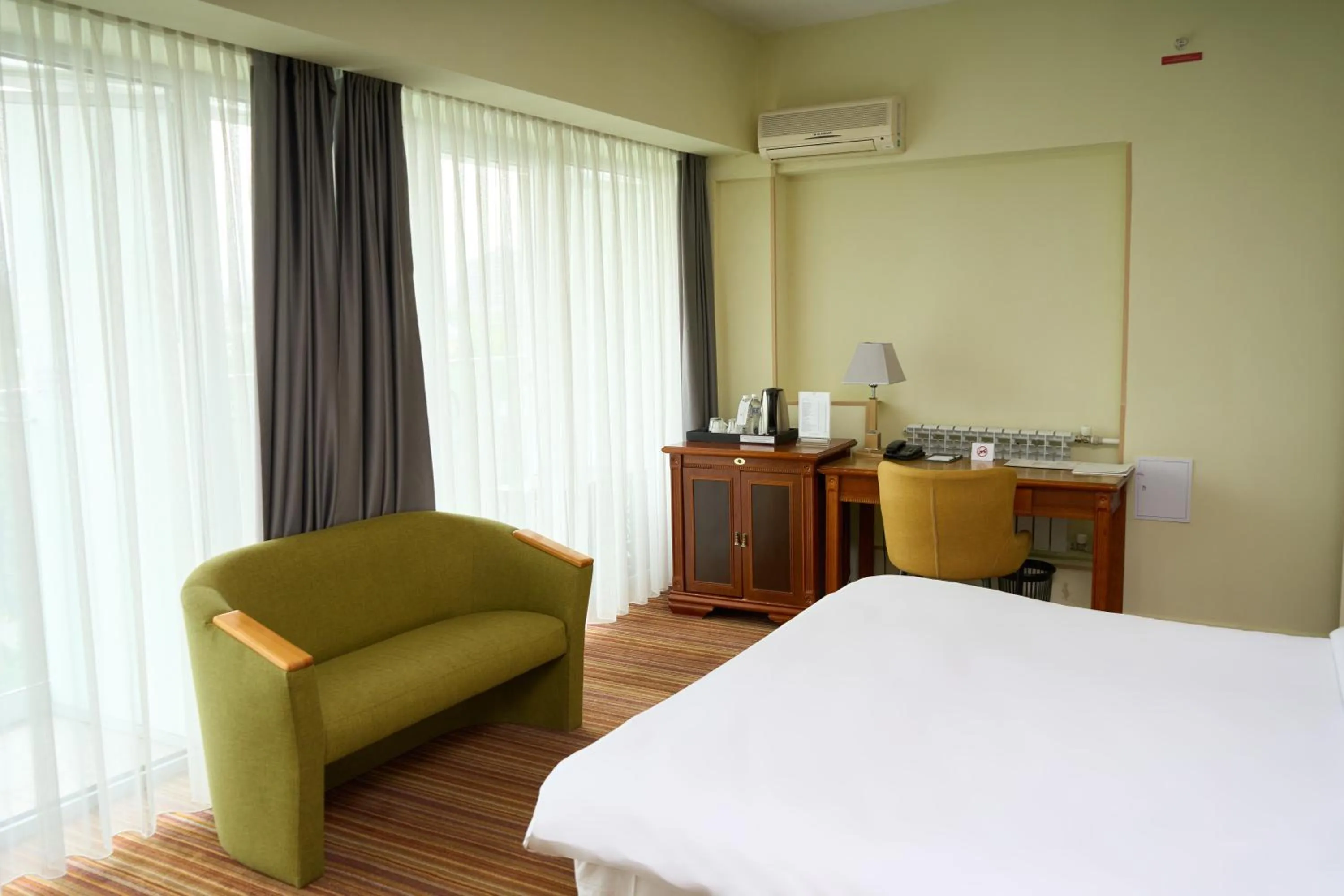 Seating area, Bed in Almaty Hotel