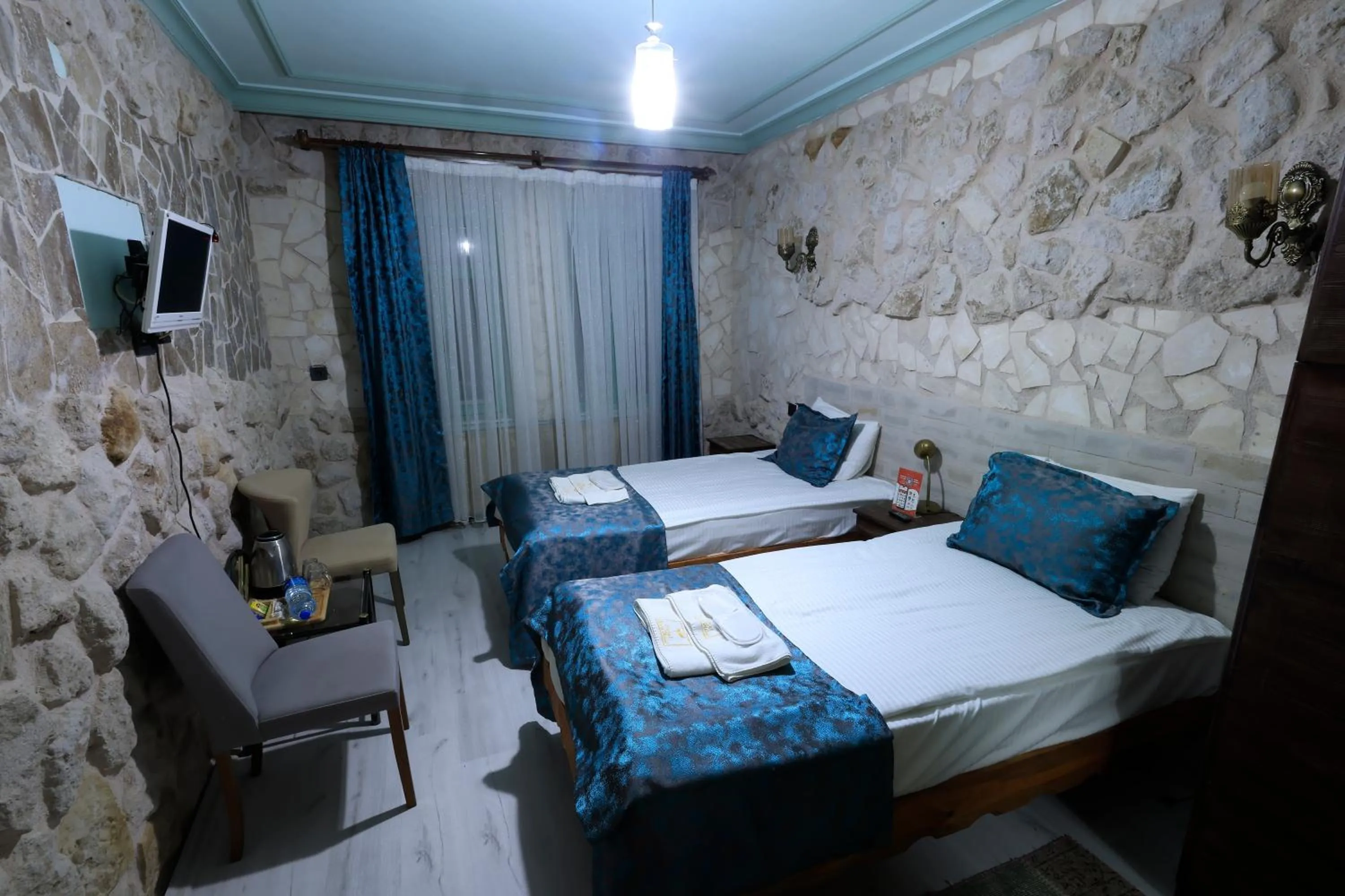 Bed in KEMAL STONE HOUSE HOTEL.