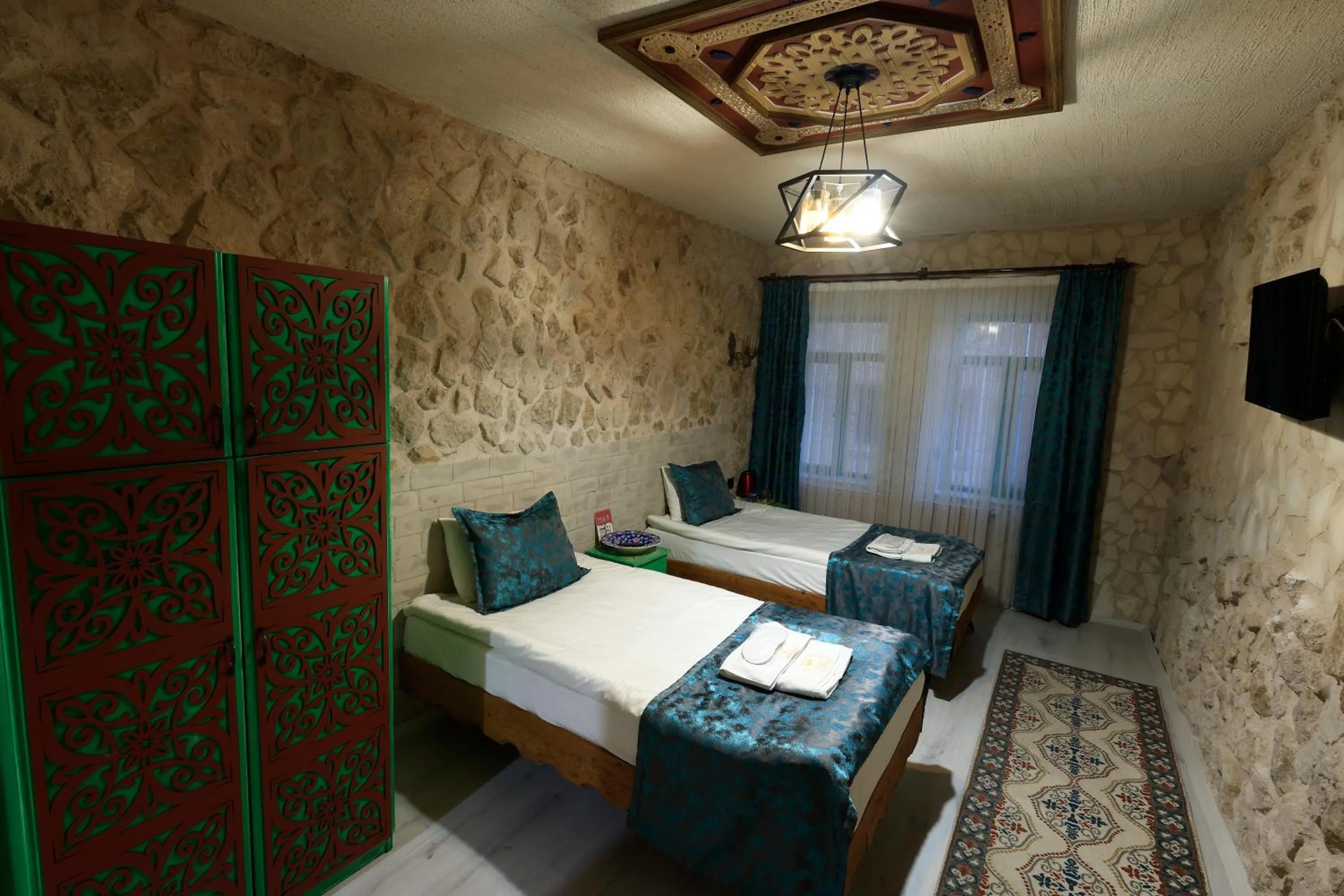 Bed in KEMAL STONE HOUSE HOTEL.