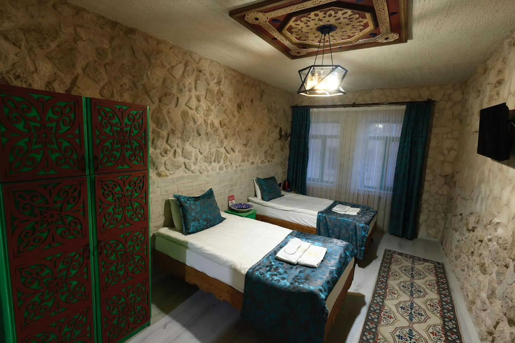 Bed in KEMAL STONE HOUSE HOTEL.