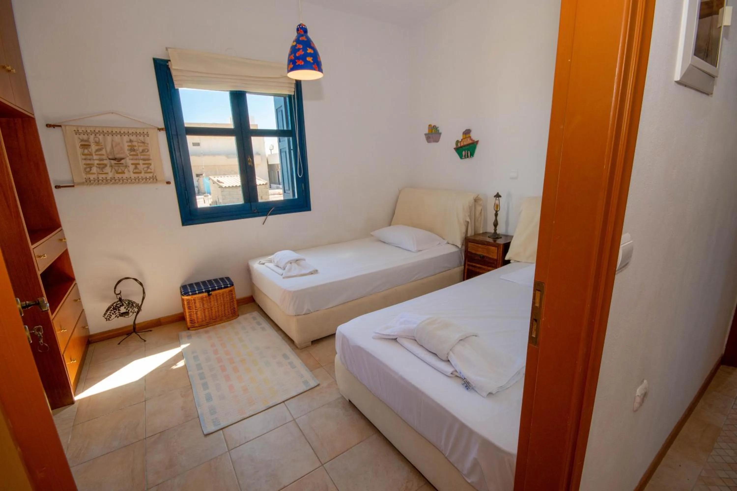 Bed in Triton Authentic Cretan Hotel