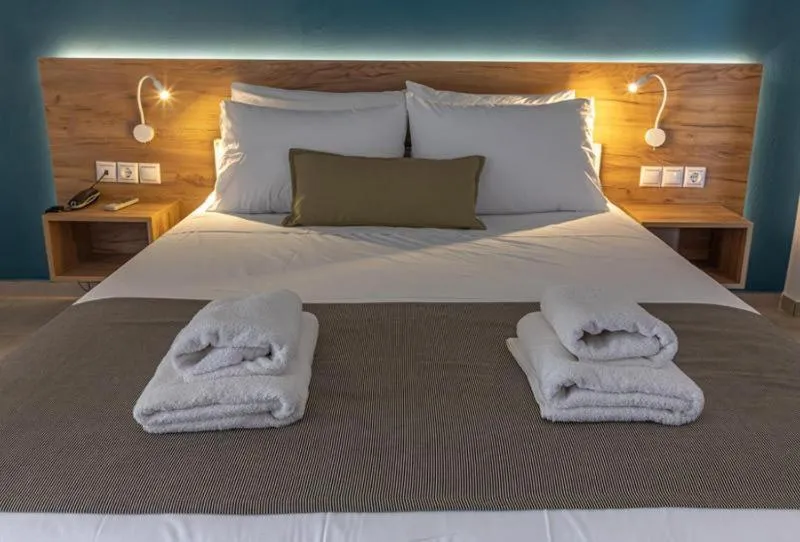 Bed in Triton Authentic Cretan Hotel