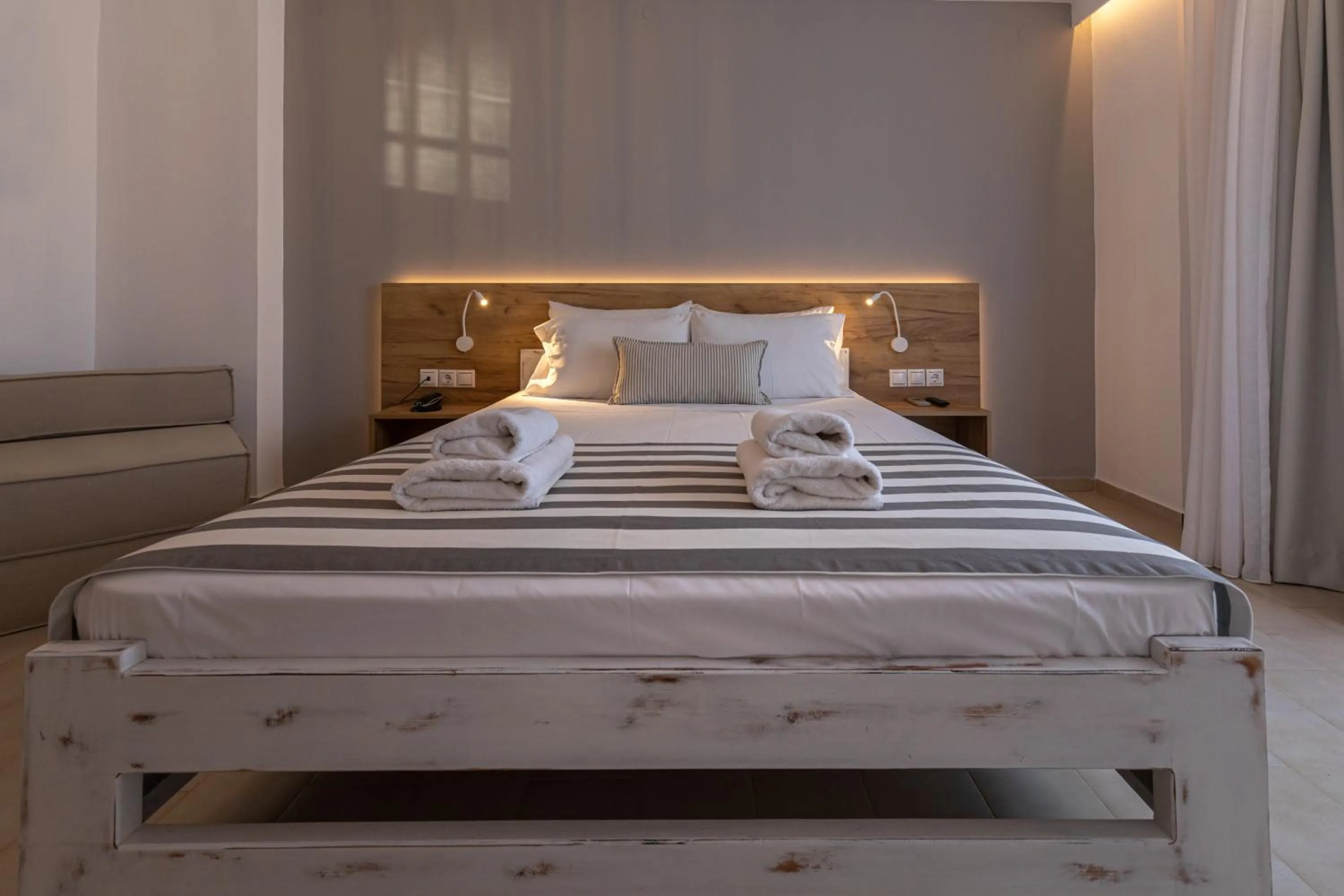 Bed in Triton Authentic Cretan Hotel