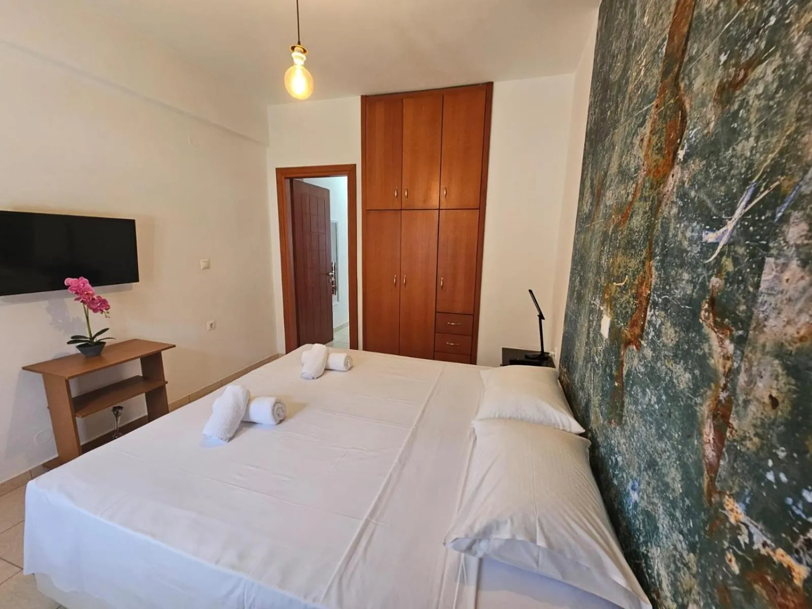 Bed in Triton Authentic Cretan Hotel