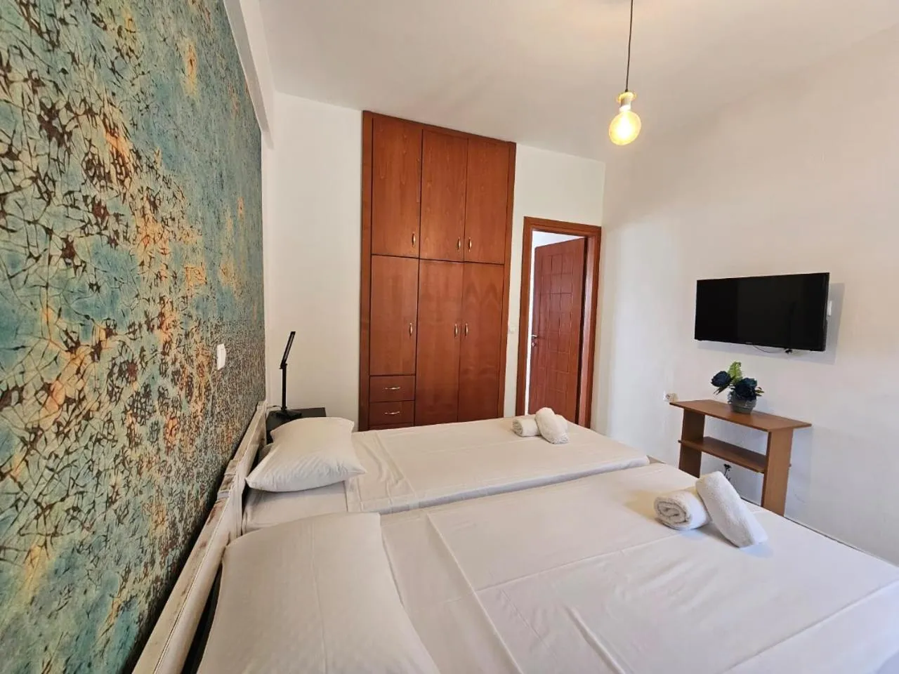 Bed in Triton Authentic Cretan Hotel