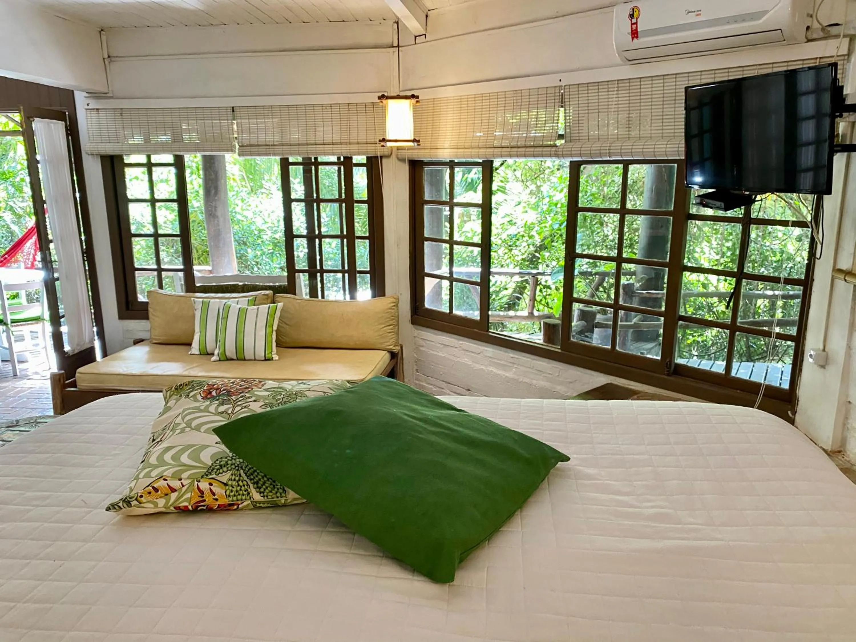 Bed in Pousada Bungalow