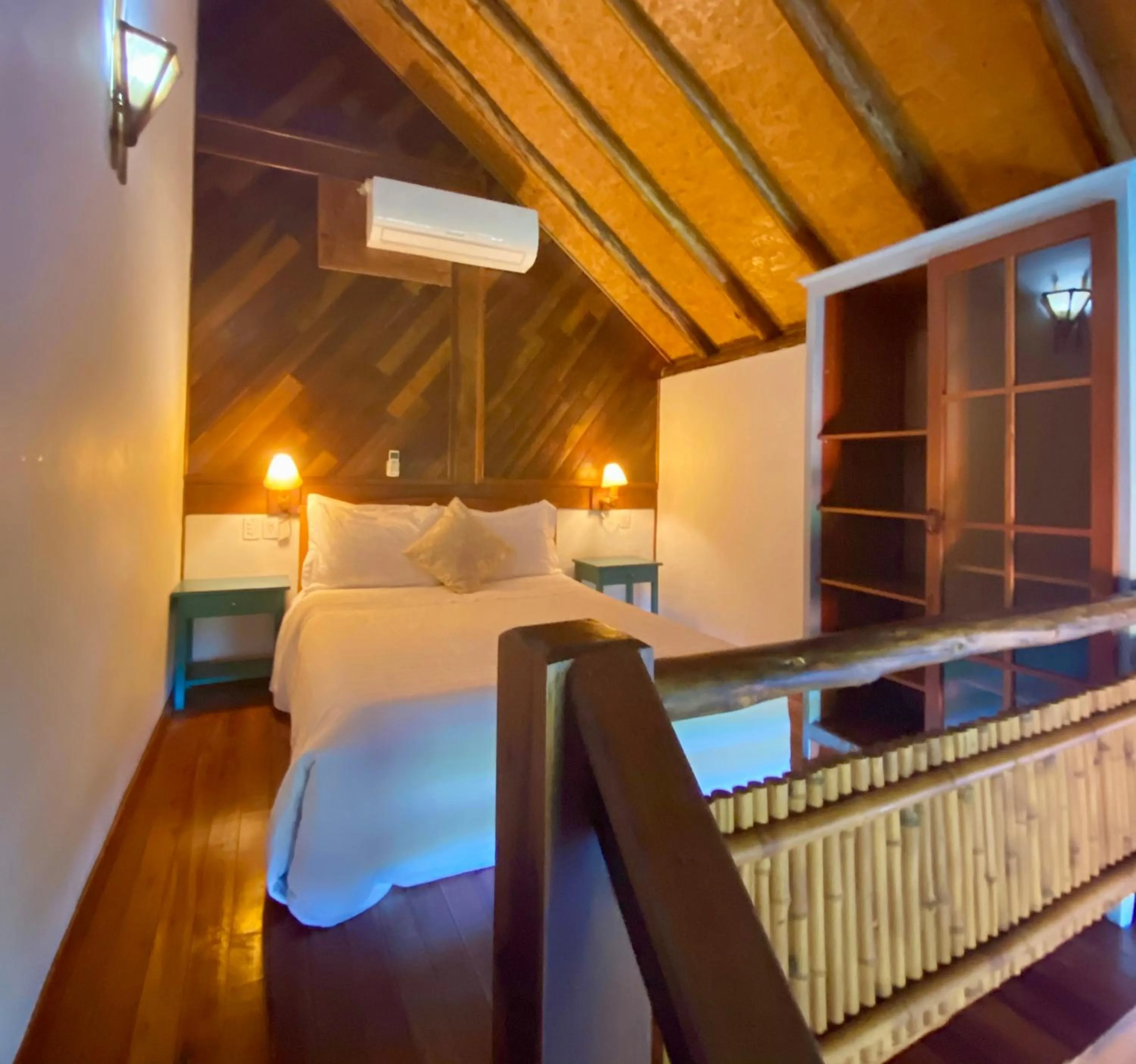 Bed in Pousada Bungalow