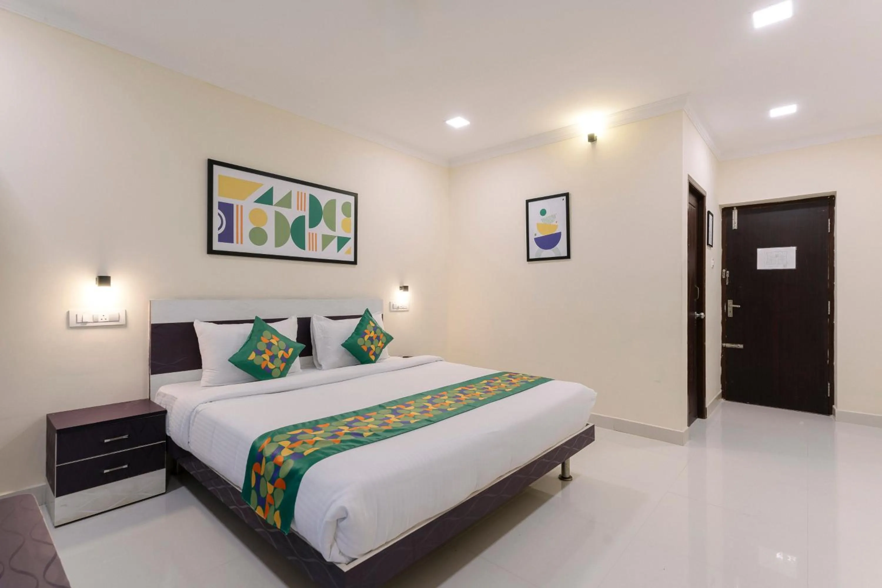 Bedroom, Bed in Treebo SNS Grand Inn With Swimming Pool