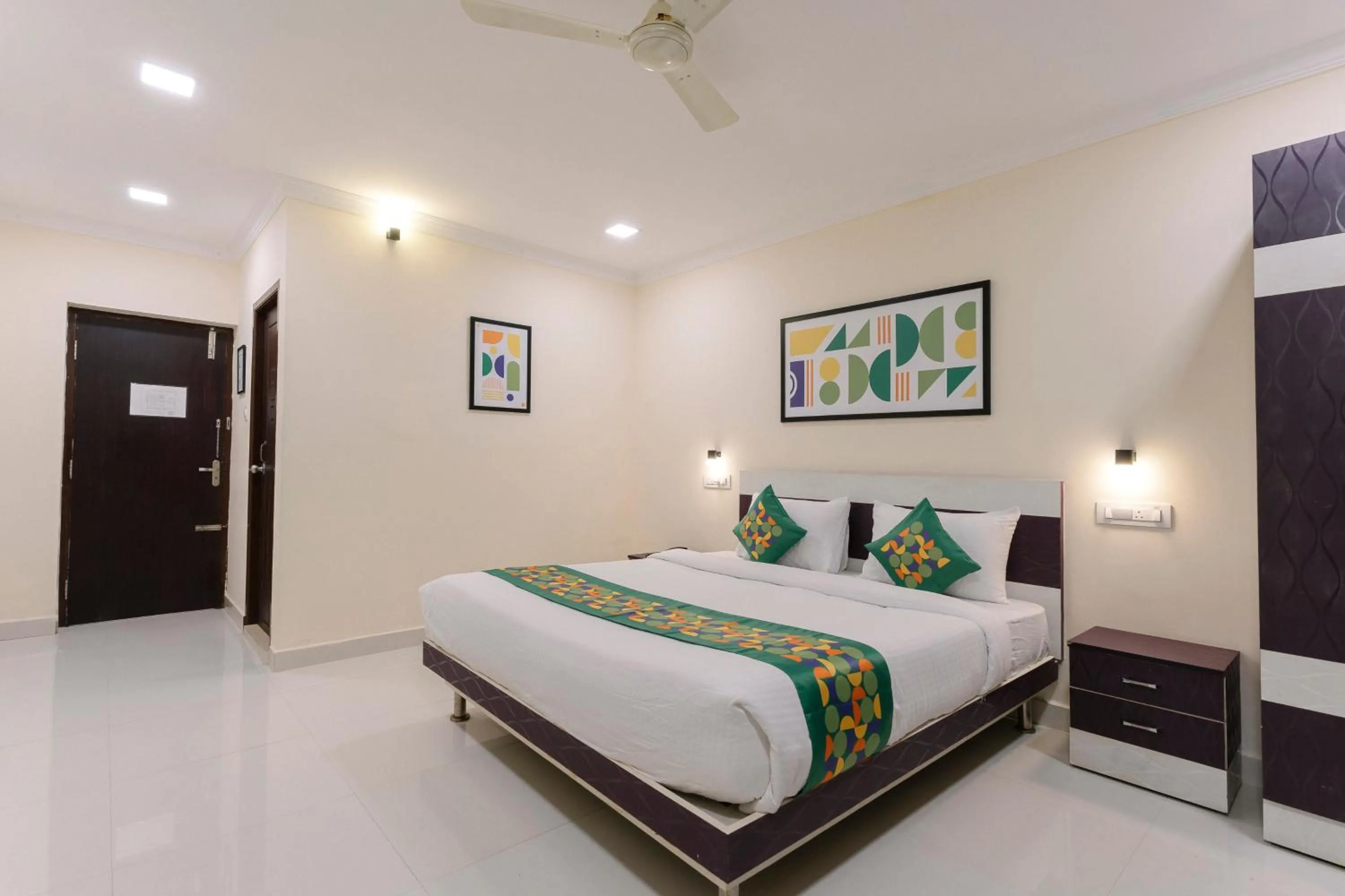 Bedroom, Bed in Treebo SNS Grand Inn With Swimming Pool