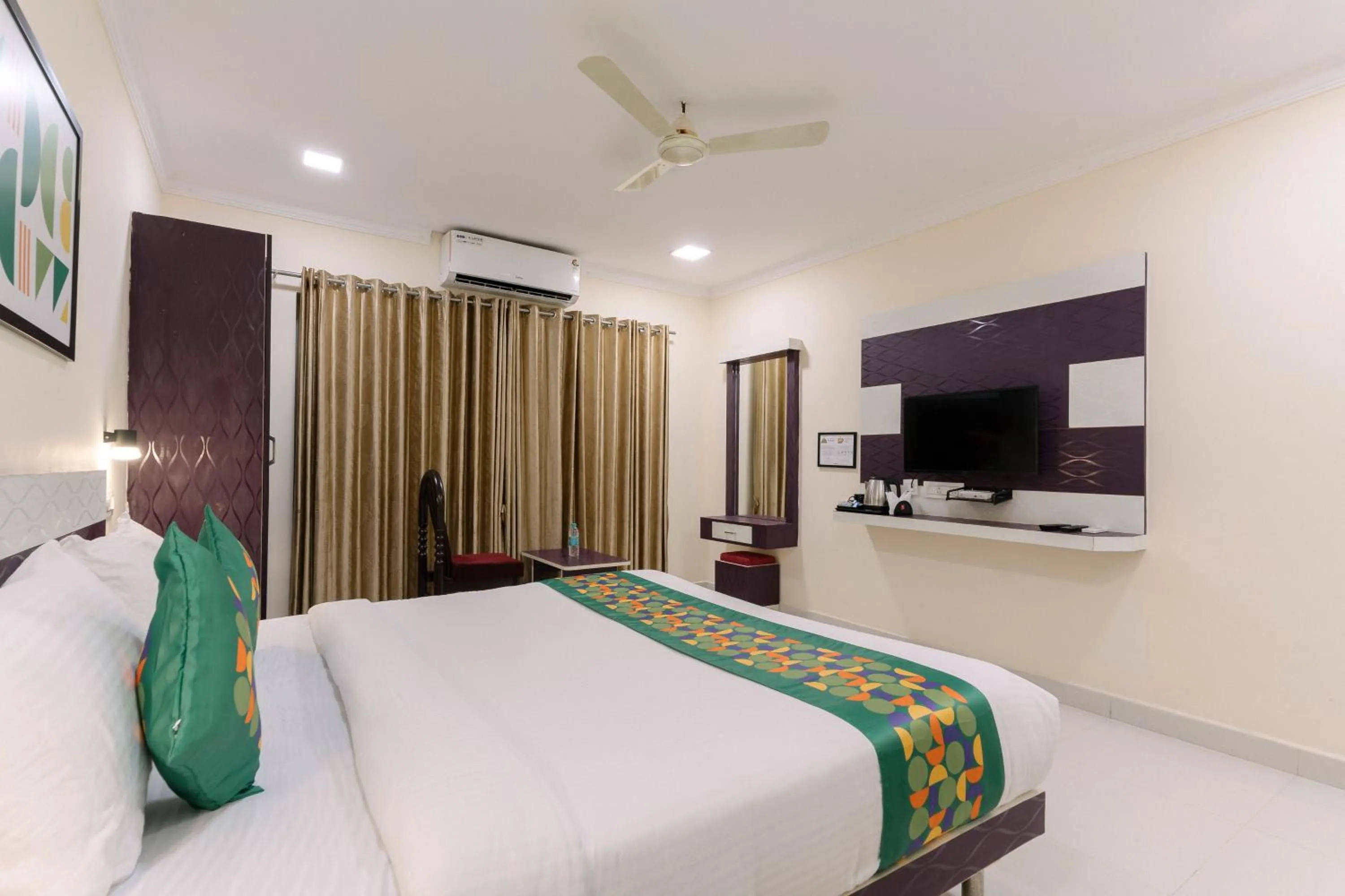 Bedroom, Bed in Treebo SNS Grand Inn With Swimming Pool