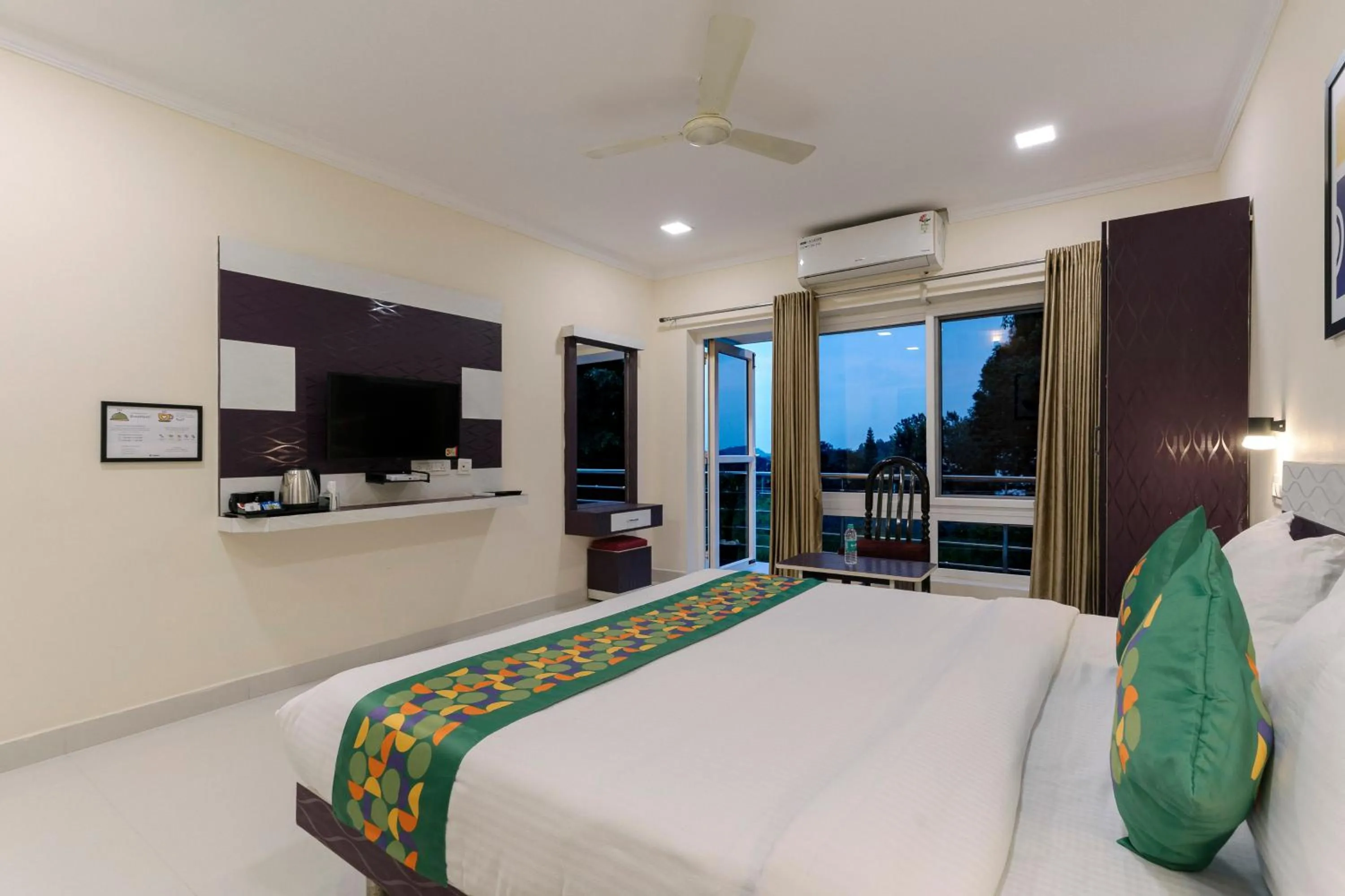 Bedroom, Bed in Treebo SNS Grand Inn With Swimming Pool