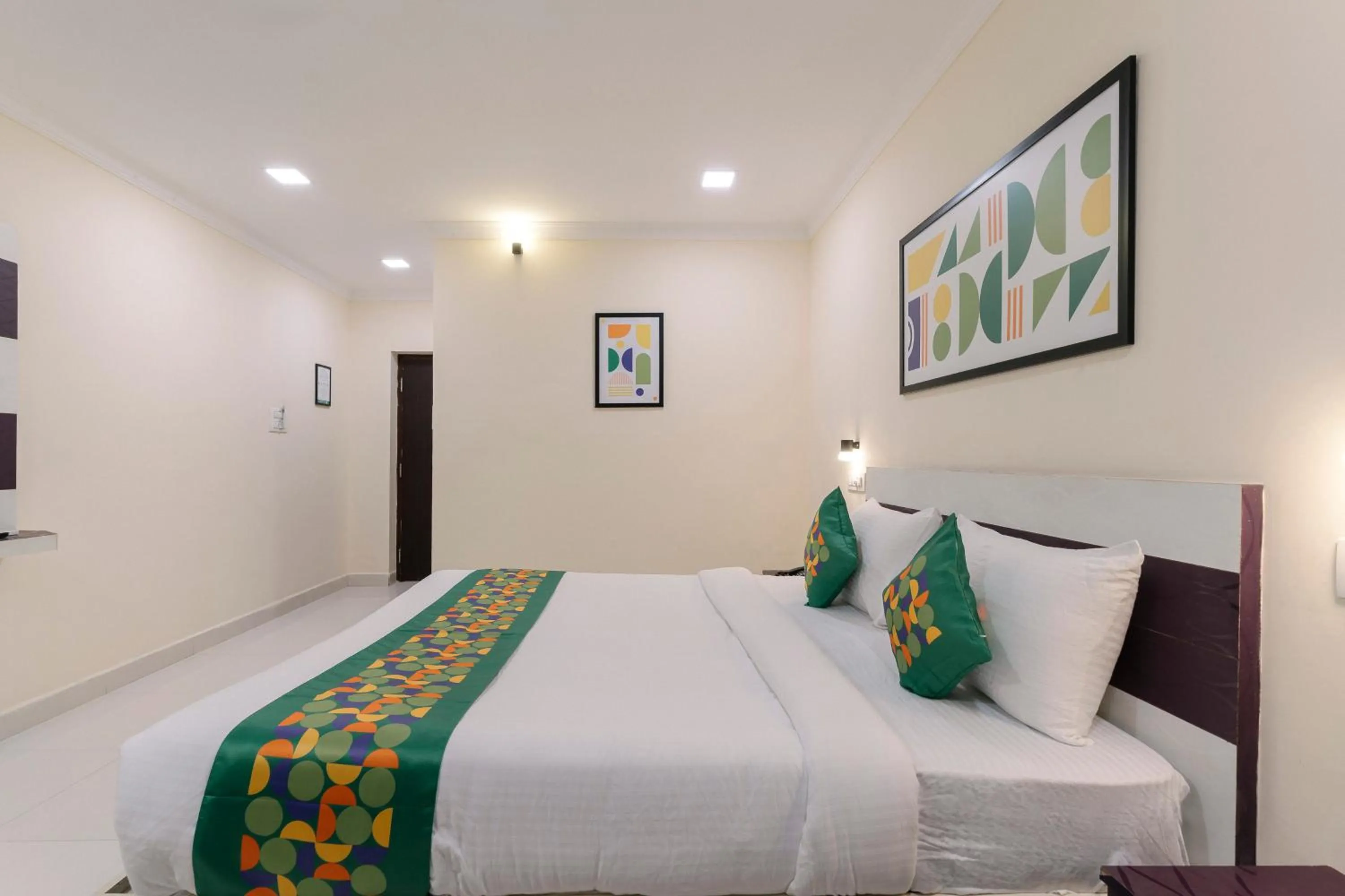 Bedroom, Bed in Treebo SNS Grand Inn With Swimming Pool
