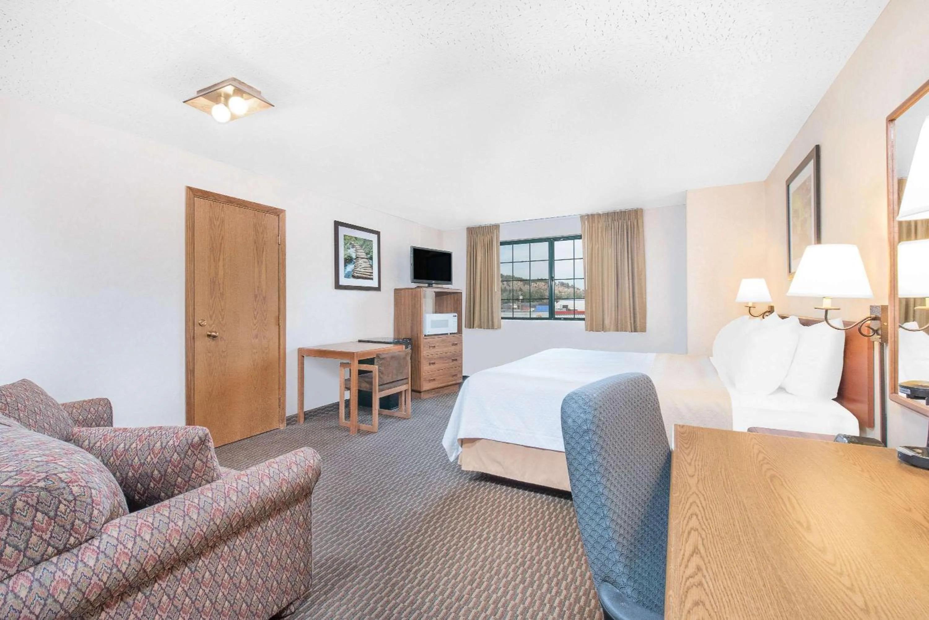 Photo of the whole room, Bed in Days Inn by Wyndham West Rapid City