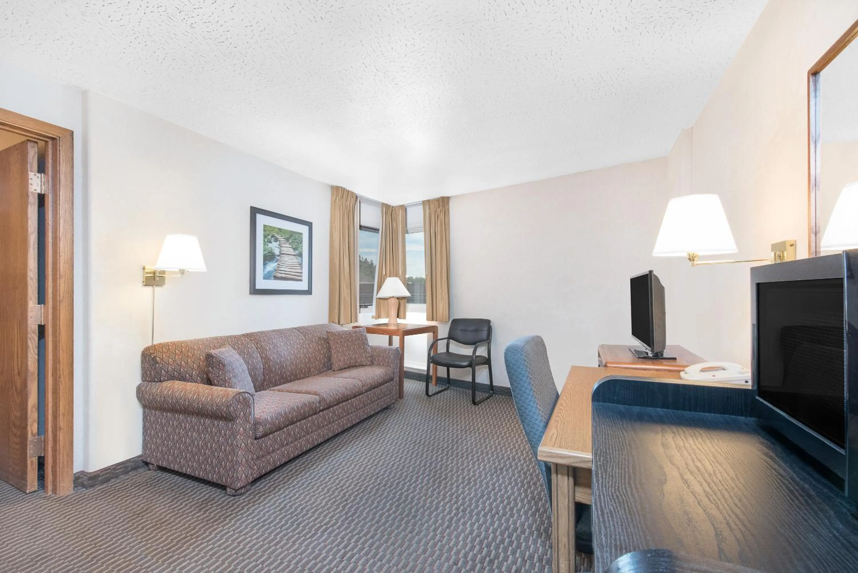 Living room in Days Inn by Wyndham West Rapid City