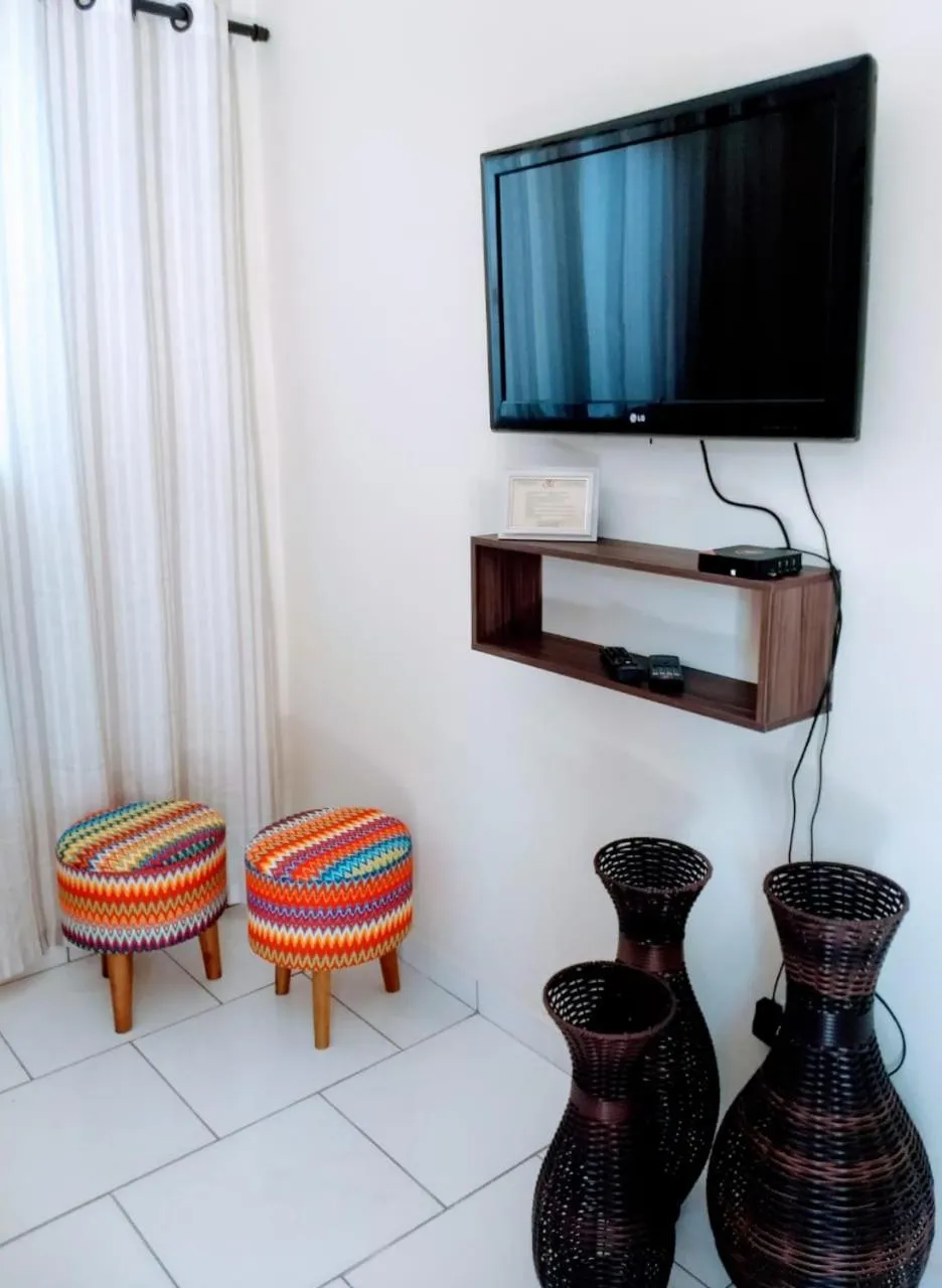 Communal lounge/ TV room in Acomodações Silvestre