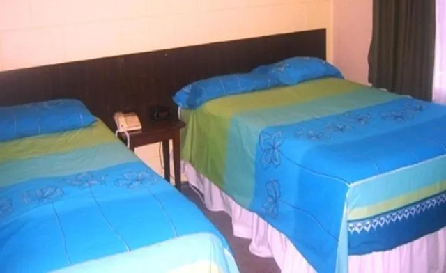 Bed in Glow Worm Motel