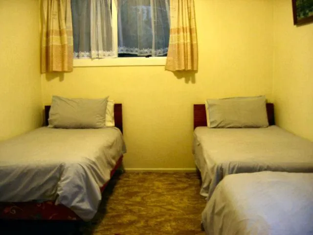 Bed in Glow Worm Motel