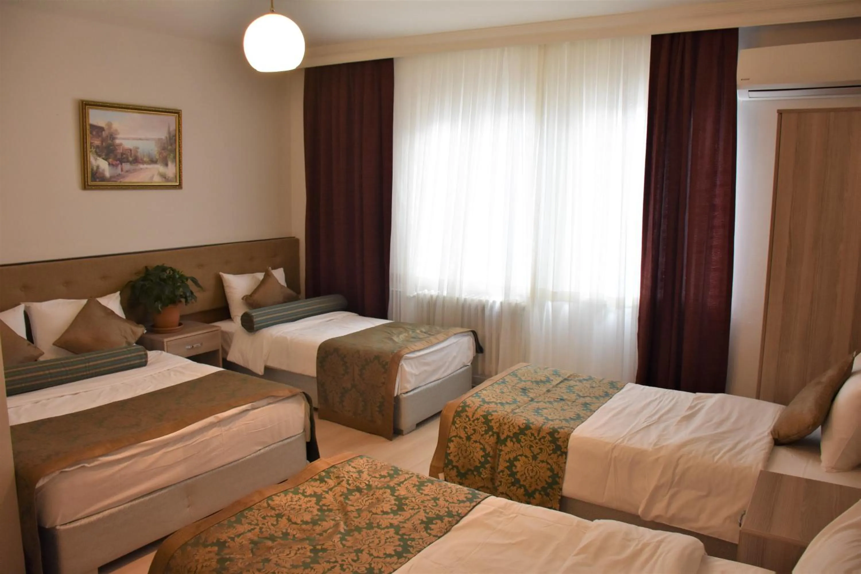 Bed in DİNAR HOTEL