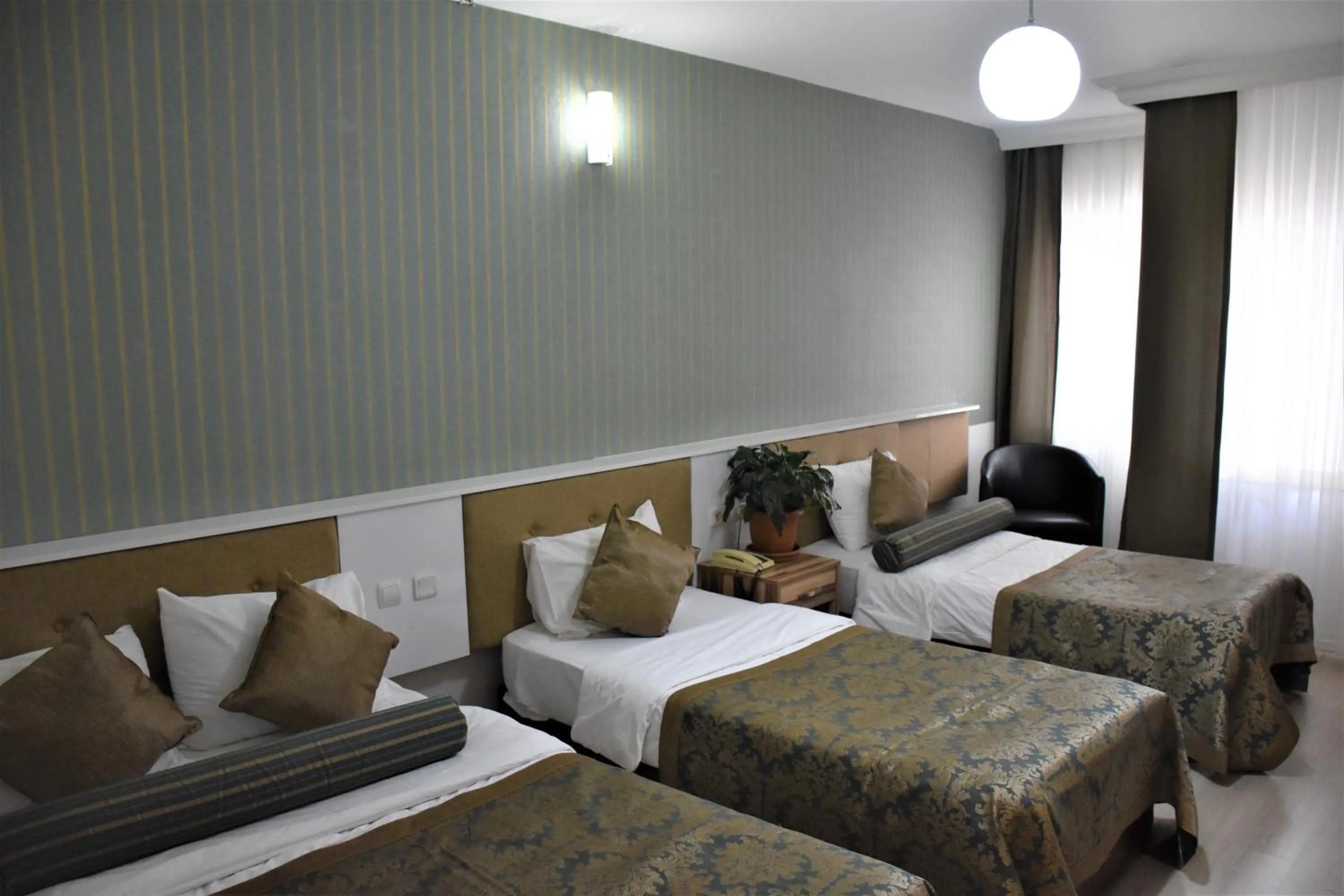 Bed in DİNAR HOTEL