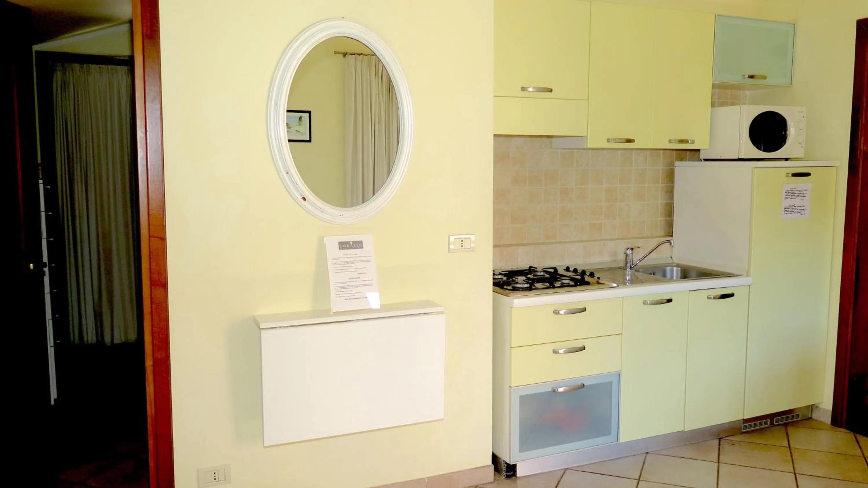 Kitchen or kitchenette in Residenza Turistico Alberghiera Corallo