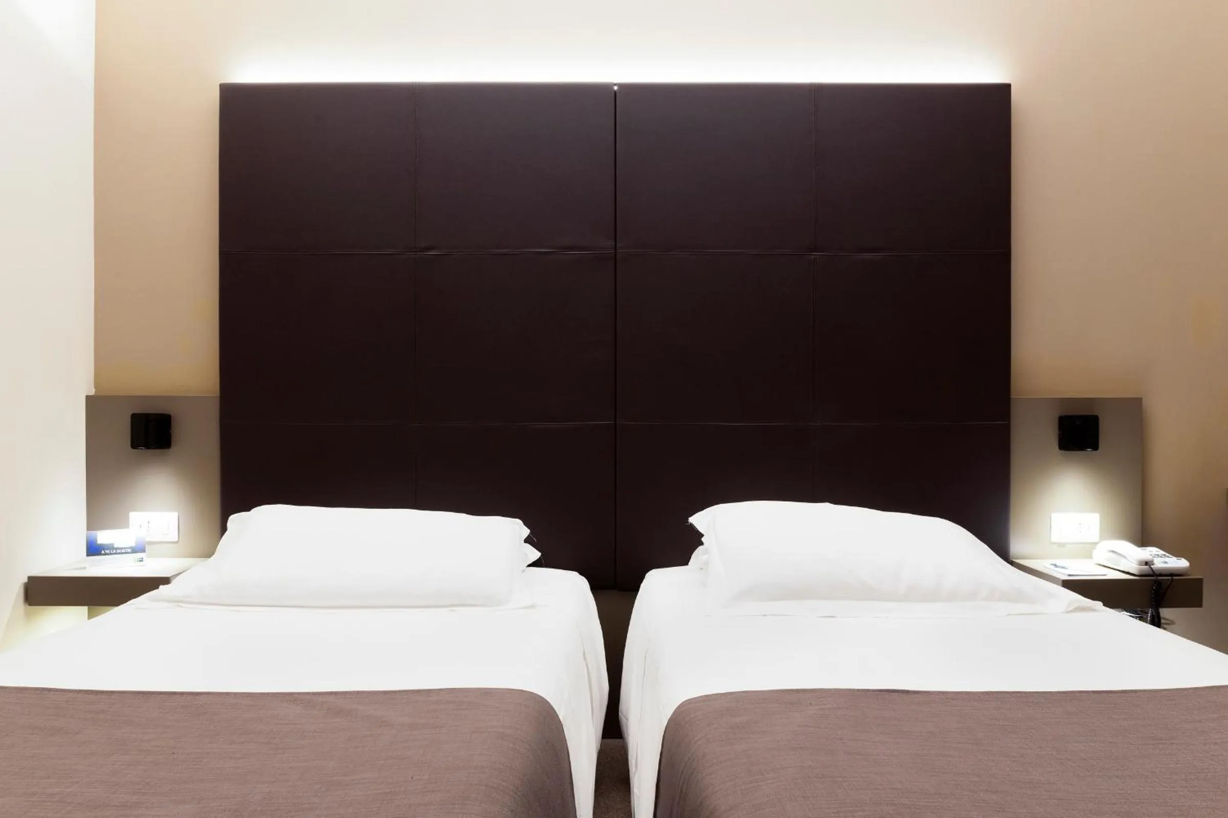 Bed in City Hotel & Suites