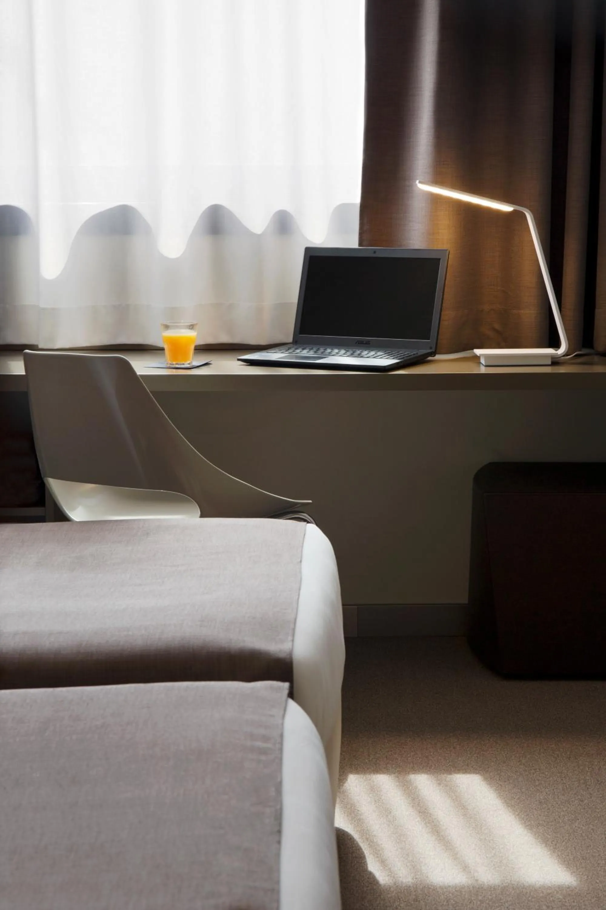 Bed in City Hotel & Suites