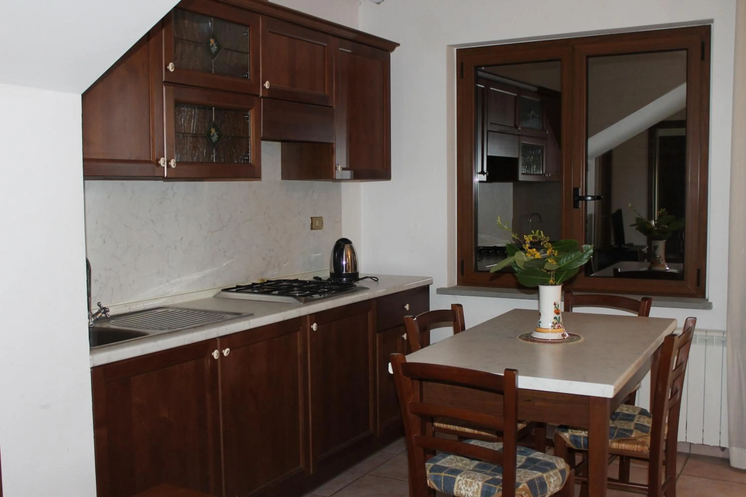 Kitchen or kitchenette in Residence La Piscina