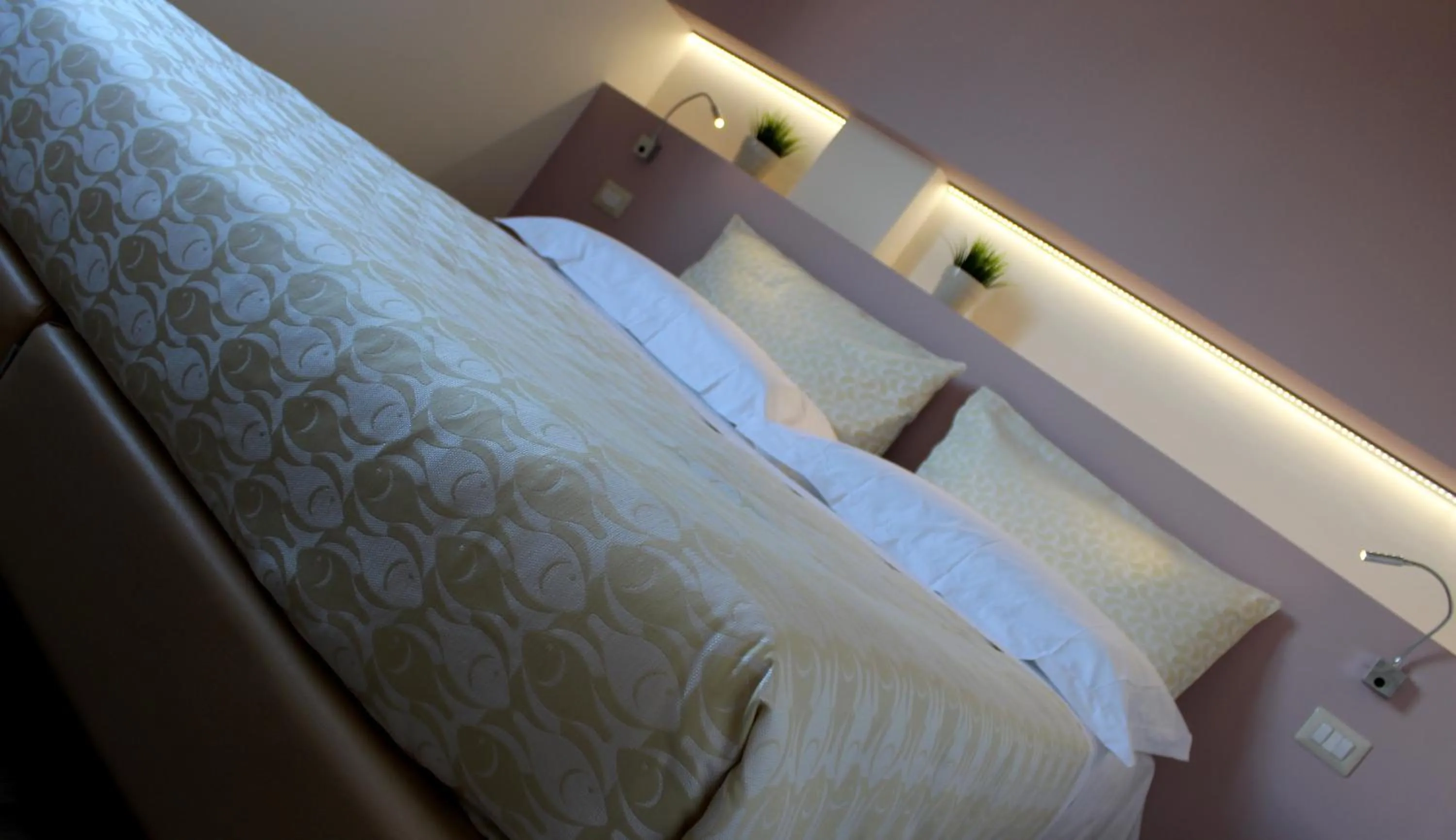 Bed in Hotel De La Ville depandance di Hotel Augustus