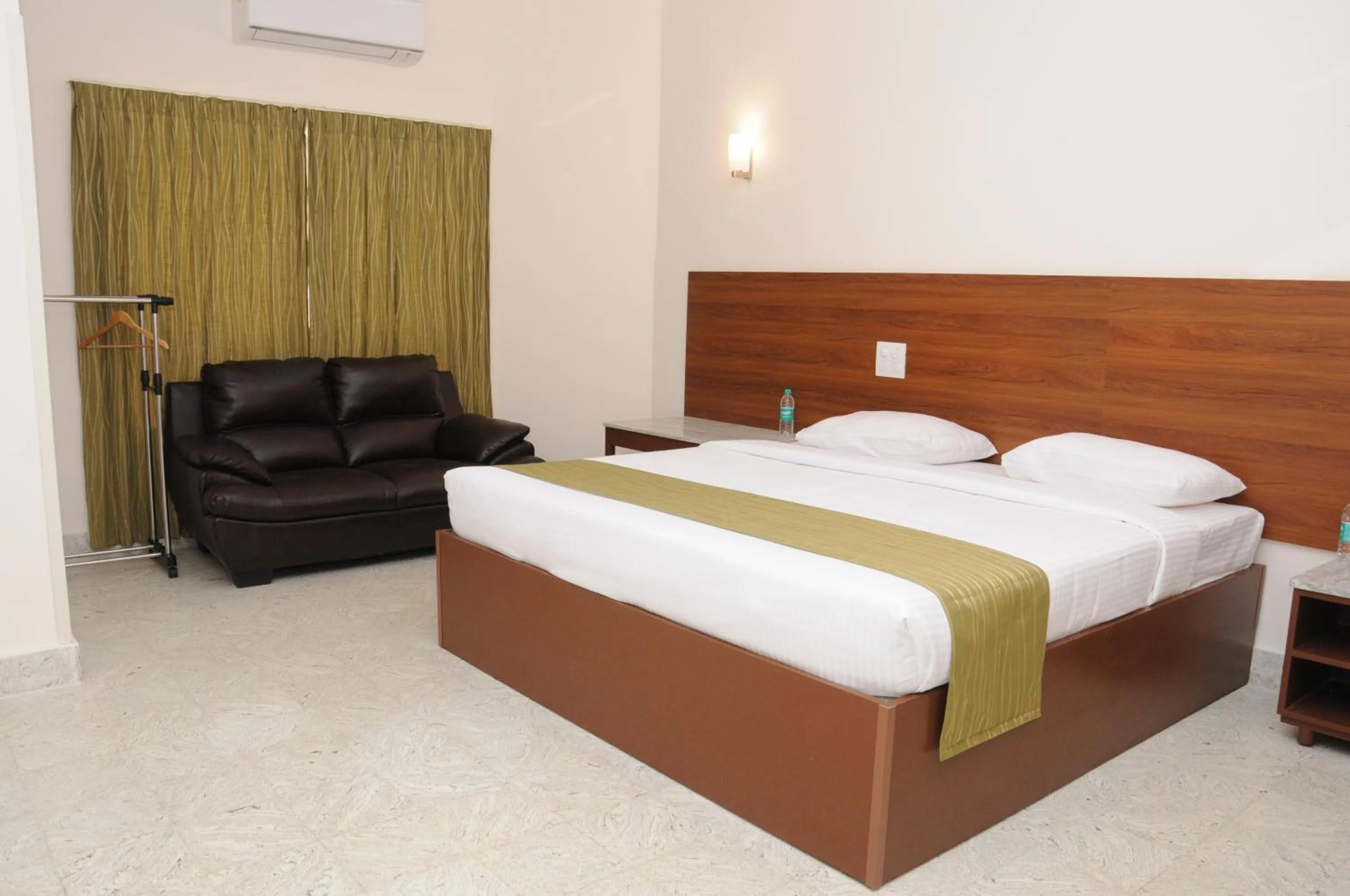 Bed in Sreeparthi Hotel